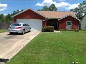 3 bedroom 2 bathroom home in the Bayou George area has a fenced back yard and pool service is included. Wood flooring through out living area, tile baths, new carpet in bedrooms. less than 1 mile from Harders Park and Bay Dunes Golf Course. All property sizes and ages are approximate, please measure and/or verify if important. School assignments are subject to change, please check with Bay County for most accurate information. Deposit is the same as the rent. Pets allowed with owner approval and NON REFUNDABLE pet fee applies per pet. Breed restrictions apply.