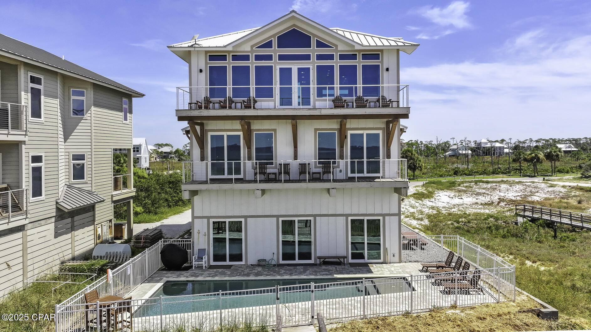 GULF FRONT GRANDEUR WITH HEATED SALTWATER POOL OVERLOOKING THE WHITE SAND BEACHES OF CAPE SAN BLAS! Experience luxury & elegance located at the most desirable end of the Cape with its wide beaches and slow, peaceful pace. This 8BR/8.5BA beachfront retreat at 149 Sapodilla Ln is designed for gatherings, comfort, and breathtaking views.The third-floor main living area is surrounded by walls of windows and soaring vaulted ceilings, filling the open-concept layout with natural light. The chef's kitchen features granite counters, modern appliances, a breakfast bar with island storage, and high-end finishes. Dine with sweeping Gulf views inside or step onto the expansive deck with contemporary cable railing. This level also includes a primary suite and half bath.On the second floor, two Gulf-facing suites boast private balconies, double vanities, and spa-like marble showers. Two additional bunk rooms, each with ensuites, provide the perfect retreat for the younger crowd. The ground floor offers a second living area, direct boardwalk beach access, and another Gulf-front suite opening to the poolside patio, plus two more ensuite bedrooms. An elevator connects all levels for convenience. Step outside to the heated saltwater pool overlooking the shoreline, an ideal place to relax or entertain. Already income-producing, this home is offered fully furnished and turn-key. Soak in the salt air breeze with morning coffee on the porch, launch a kayak from the beach, or fish along the sugar-white, pet-friendly shoreline. Spend afternoons by the pool with panoramic Gulf views and unwind each evening as the sun sets over the horizon. Cape San Blas also offers paved biking and walking trails, horseback riding on the sand, and easy access to dining, shopping, and entertainment. Built for beachfront living and move-in ready, this home is truly one of a kind. Call today for your private showing!