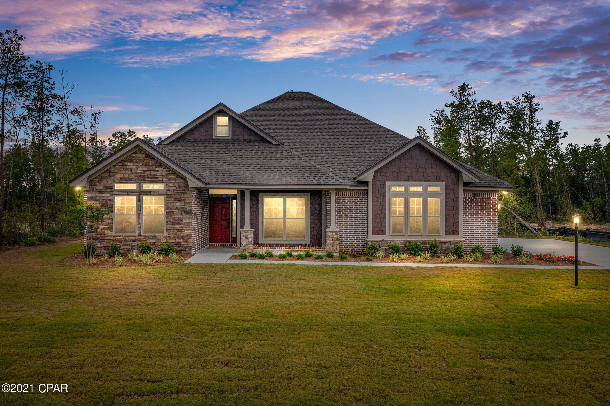 CURRENTLY UNDER CONTRACT; SELLER ACCEPTING BACKUP OFFERS



Welcome to Lake Merial, a private, gated community just 15 min. north of Lynn Haven!  This 2021 custom home features an elegant brick and stone exterior that is nestled quietly on over a half an acre lot. From the moment you enter through the front door, you will experience walking into a luxurious setting with vaulted ceilings in the living room, and you will be captivated with the abundance of windows that lets natural light shine in every room in the house.  This three-bedroom, two-bathroom home has a split floor plan, and the kitchen is open to the living room featuring a gorgeous fireplace and mantel to match the custom kitchen cabinetry. The living room opens to a back covered patio that can bring in the sounds of nature right into your home.  The home also features wood-look vinyl flooring, stainless steel appliances, serpentine stone countertops, front and rear covered porches, and an oversized laundry room with more custom cabinetry. The storage space in this home is endless! The sizable master suite contains a huge walk-in closet, and the master bathroom boasts a double vanity, walk-in tile shower with custom seat, and separate toilet for privacy.  This peaceful gated community is an outdoor lover's ideal location offering various hiking trails and green space for picnics and outdoor sports activities. Lake Merial is a spring fed lake with crystal clear water and offers various water activities such as kayaking, paddle boarding, canoeing, and freshwater fishing.  This Lake Merial Trail home is the perfect escape for someone looking to buy an experience, as much as they are looking to buy a forever home.