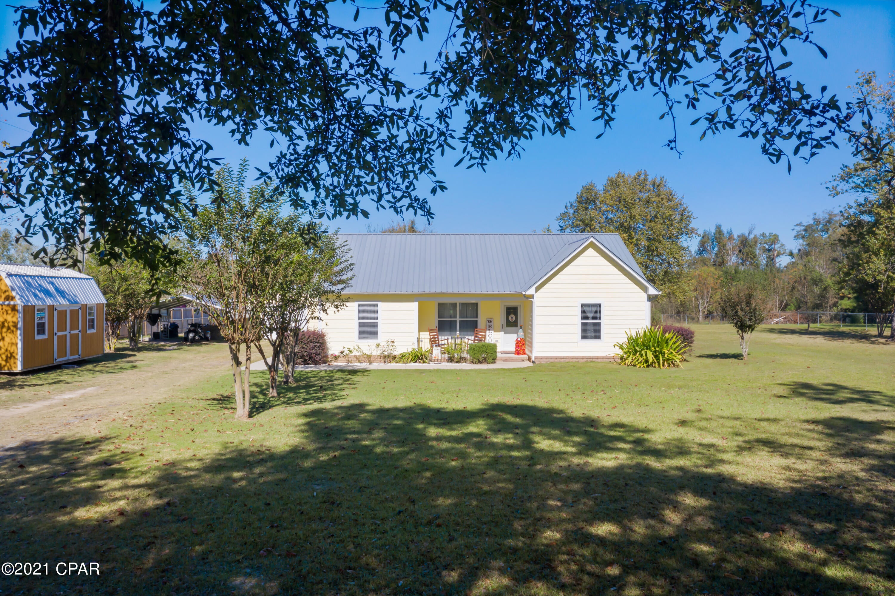 Currently under contract, owner will take back up offers..  Beautiful county home on 1 acre ,about 6 miles from Chipley ,45 minutes to the Worlds Most Beautiful Beaches. This 3 bedroom / 2 bath home is immaculate with  fresh paint, new flooring ,new a/c unit.Living area has vaulted ceiling ,nice  29 ft heated and cooled Florida room just off the kitchen. Large fenced in yard with nice trees and plenty of room to have a  garden. A wonderful above ground swimming pool, lots of outside storage with a 10x20 out building and a 20x30 Garage /workshop . You will love this home ,its ready for its new owner.