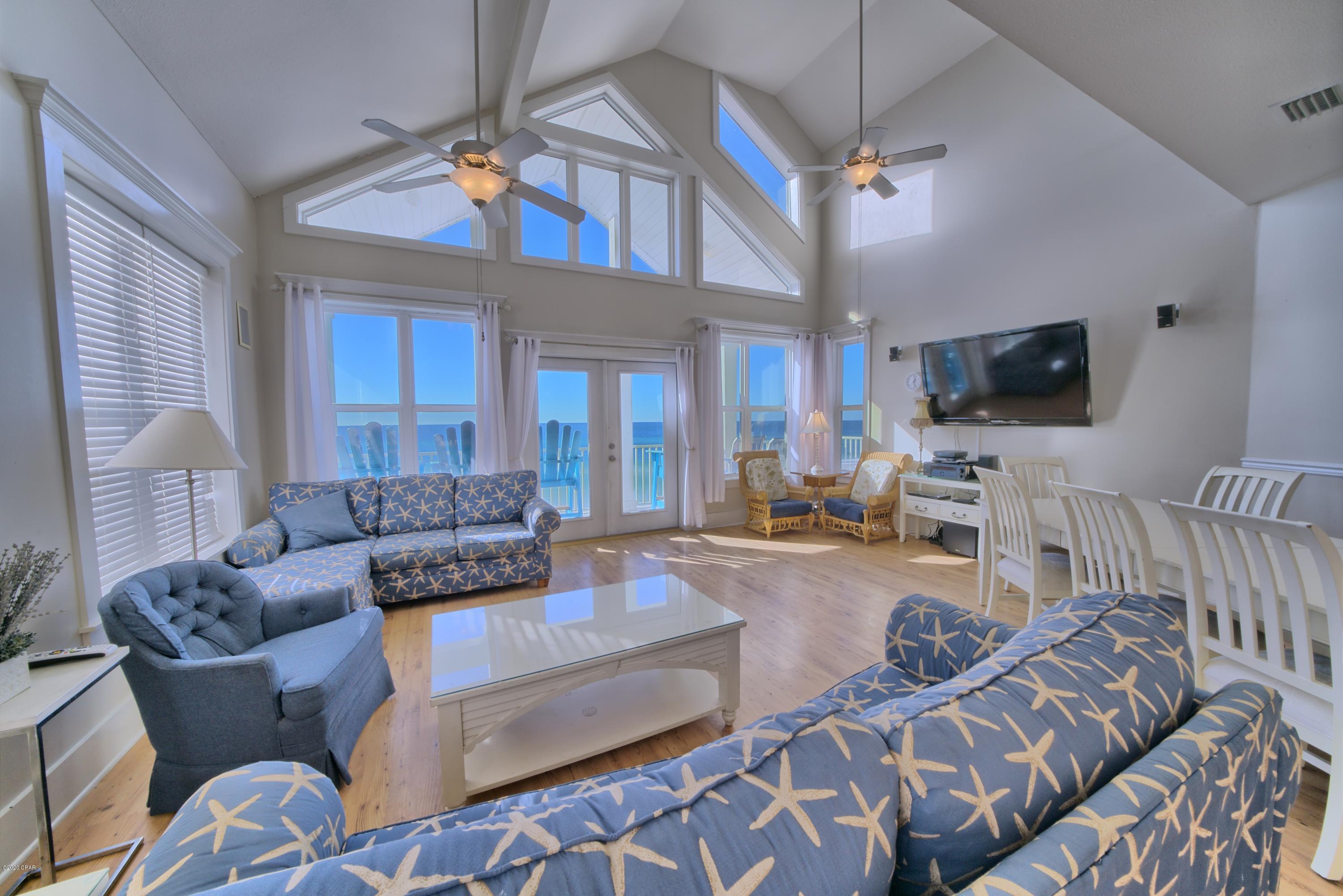 One of the most striking beach front homes in Panama City Beach with 9 bedrooms (plus loft) and 7 baths. Located on the highly desired west end in the La Valencia Neighborhood which includes 2 pools, tennis court and club house. This practical floor plan is divided into two separate homes with their own individual entries. First floor is four bed three bath with a master and full kitchen with huge ocean views and large ocean front balcony with direct beach access. The 2nd and 3rd floor is a five bedroom four bath plus a loft, master, full kitchen, ocean front balcony, and direct beach access. Great for large families, corporate parties and vacation rental. Currently has reservations on the books