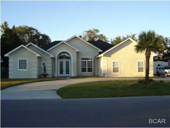 Beautiful like new executive home built in 2006 with circle drive and a majestic entrance with 14 foot high ceilings. The open floor plan adds to the already spacious, open feeling. What great floorplan for entertaining. Master bedroom suite is truly BREATH TAKING. This room is very spacious with high ceilings, 2 large walk-in closets with organizers and a large linen closet, a double glass door that exits to the inground pool, Hot Tub and covered Lanai area. The pool is surrounded by Brick Pavers and set in a spacious privacy fenced back yard. In addition to the awesome master is a STUNNING bathing area. The bathroom is large and features a Jacuzzi step up bathtub, a large roman style tiled shower with ceiling shower head and double Corean top vanities. There is carpet in the