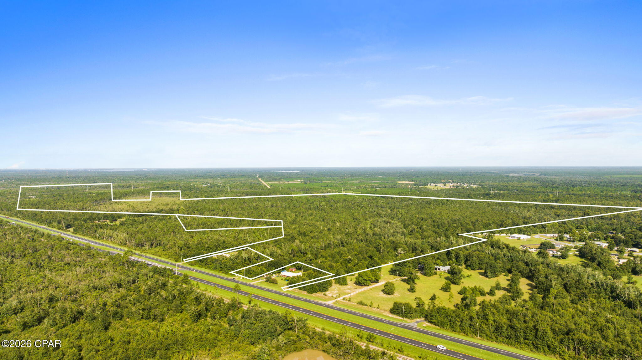 323 RAW ACREAGE AVAILABLE - Discover an exceptional development opportunity with approximately 323 acres strategically located along Highway 231. Zoned commercial/agriculture and offering multiple access points from the highway, this expansive property provides flexibility for a variety of potential uses. Its highest and best use may be a thoughtfully planned single-family residential community, with ample space to create a neighborhood that balances convenience, privacy, and Northwest Florida's natural surroundings. Located just a few miles from the busier areas of town and within convenient driving distance of the area's beautiful beaches, this property offers the accessibility today's buyers want while maintaining plenty of room to grow. A rare opportunity for developers and investors seeking substantial acreage in the path of future growth. Buyer to verify zoning, land use, access, utilities, environmental conditions, and development potential.