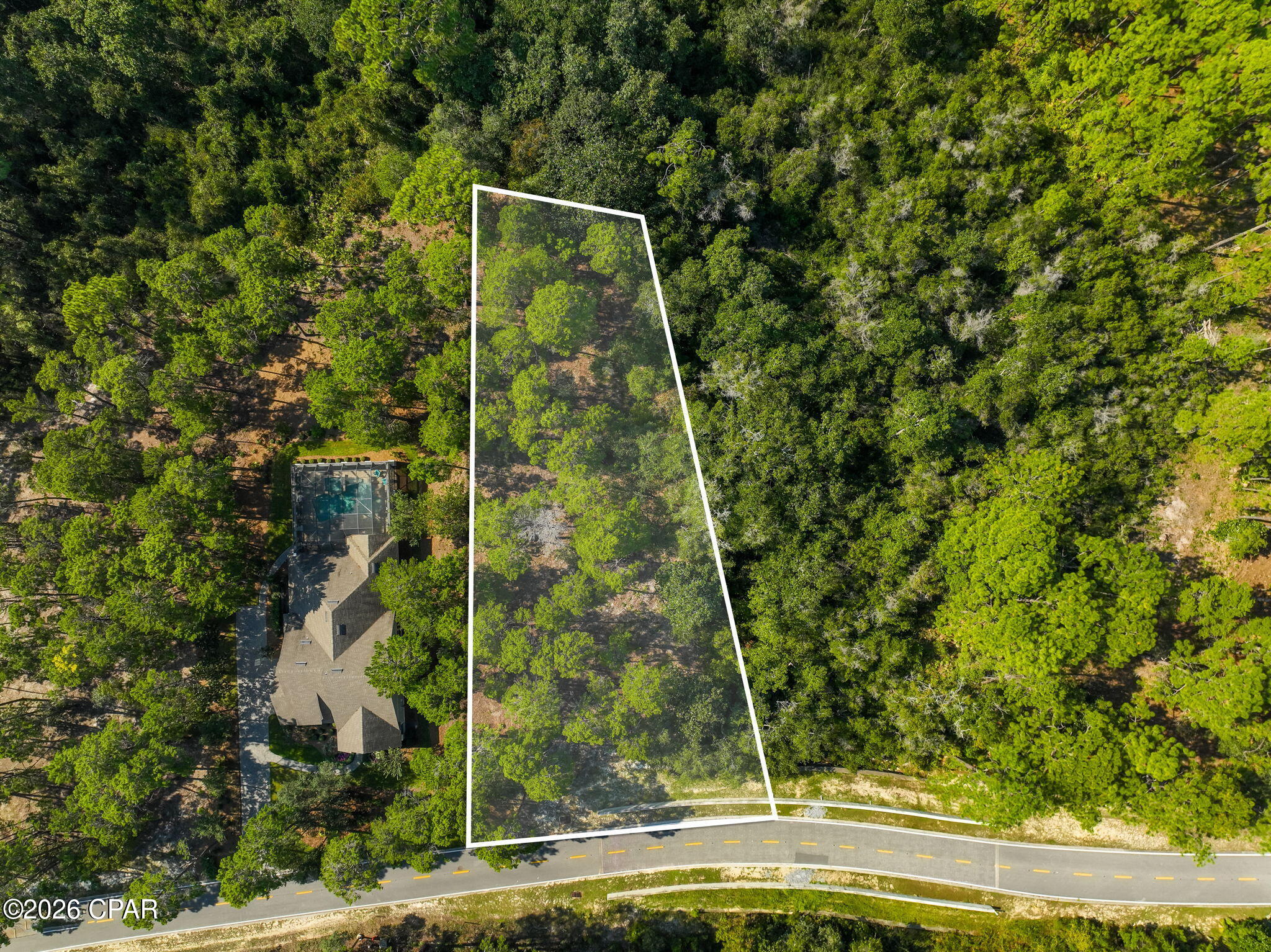 This .55-acre vacant lot is located in the gated Wild Heron community, offering access to beautiful natural surroundings and a variety of amenities. Residents enjoy access to Lake Powell, walking trails, an updated  fitness center, community pool + hot tub, and fire pit. Wild Heron is also home to the award-winning Watersound Club golf courses: Shark's Tooth and 'The Third', complimented by a newly renovated Clubhouse. (Golf & tennis are part of the Watersound Club membership).