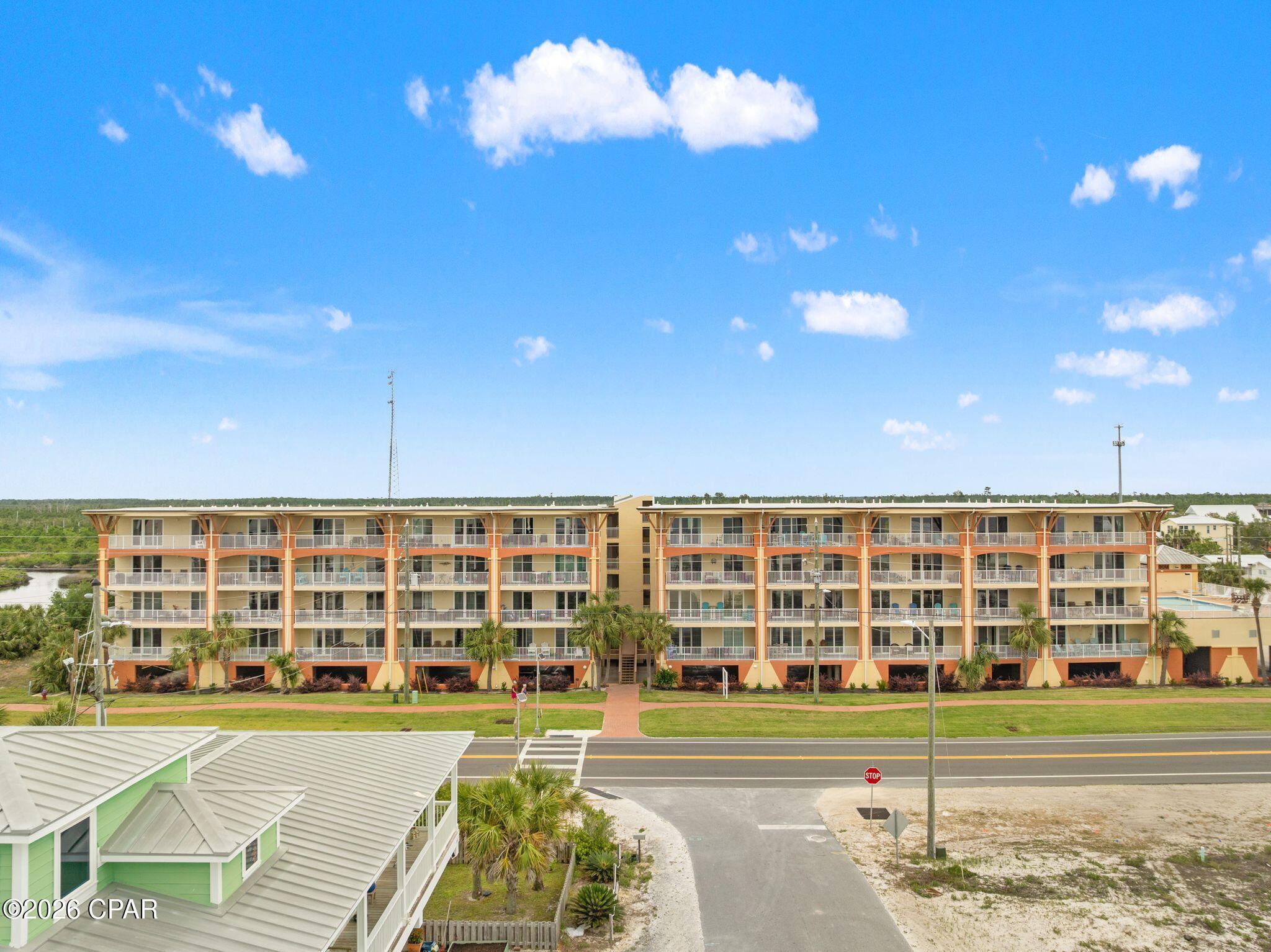 Welcome to Unit 402, a beautifully updated top-floor, 2-bedroom, 2-bath condo offering stunning Gulf views, exceptional privacy, and one of the most desirable positions in Summerhouse at Mexico Beach. This light-filled residence features an open-concept layout with tile flooring, and a clean coastal design throughout. The spacious living and dining areas flow seamlessly to a large private balcony, where you'll enjoy panoramic Gulf views, sea breezes, and front-row sunsets. The kitchen is thoughtfully designed with white cabinetry, updated hardware, solid surface countertops, bar seating, and full appliance package, making it ideal for entertaining or extended stays. A full-size in-unit washer and dryer adds everyday convenience. The primary suite offers a relaxing retreat and an en-suite bath, while the guest bedroom and additional sleeping space provide flexibility for family, guests, or strong rental income potential. Step outside to a large balcony, perfectly positioned to capture both east and west Gulf views--ideal for morning coffee and evening unwinding. Summerhouse amenities include a pool, hot tub, sauna and covered parking, and just steps from the sand. Whether you're searching for a full-time residence, vacation getaway, or high-performing rental, this top-floor Gulf view unit delivers on location, layout, and lifestyle. Opportunities like this in Mexico Beach are limited--schedule your showing today.