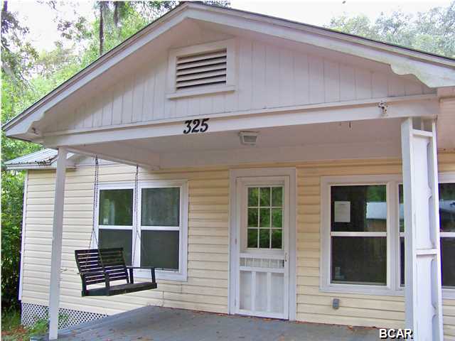 This charming three bedroom two bath cottage home is located in historic Millville and is surrounded by enormous gorgeous mature oaks that provide plenty of shade on those hot summer days. The front porch invites you to sit and appreciate a good cup of coffee as you observe your neighbors stroll by on their morning walk. You enter the home through the large warm and inviting living room that opens up to a galley kitchen with lots of counter and cabinet space. The master bedroom is huge with bead board walls gorgeous wood work and plenty of closet space. There are two additional bedrooms that are quite large with ample closet space. This home wreaks of Southern charm from the front porch to the sturdy metal roof it simply needs the right owner to bring it back to life. This is a Fannie Mae Homepath Home. All measurements, ages, and room sizes are approximate. Please verify if important.