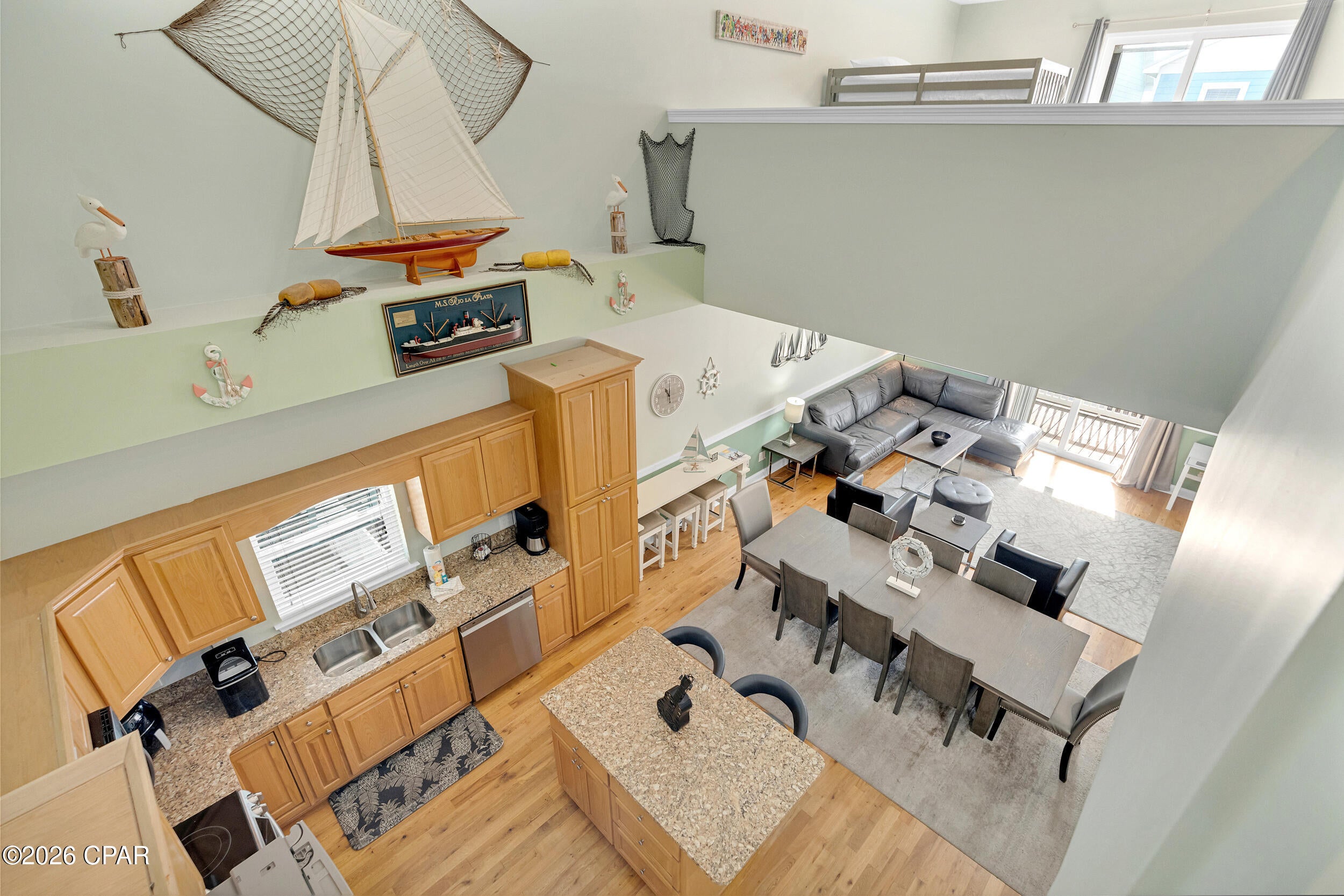 Located just steps from the sugar-white sands of Panama City Beach's quiet east end, this beach home combines the best of location, functionality, and flexibility. 

With no HOA and the freedom to offer short-term rentals, this property is ideal for a serene retreat, full-time residence, or vacation rental. The thoughtfully designed layout spans multiple levels, ensuring both privacy and spaces for gathering. 

The first floor features three bedrooms, two full baths with granite countertops, and a convenient laundry area. 

Ascend to the second floor to a spacious great room with cathedral ceilings, beautiful hardwood floors, and an open kitchen. Stainless steel appliances, a kitchen island and breakfast bar make this space functional and inviting - perfect for hosting or enjoying casual meals. Step out onto the second-floor balcony to enjoy a morning coffee or the evening breezes. The master suite on this level creates a private sanctuary, complete with a well-appointed bathroom featuring a walk-in shower and separate water closet. 

On the third floor, you will find another balcony and a versatile loft area that can be transformed according to your needs - whether as an additional bedroom, game room, or entertainment hub. 

Outside, the fenced yard and patio area provide a private space for relaxation or gatherings. 

Located just a short stroll from local favorites like Schooner's and a quick drive to St Andrews State Park, marinas, golf, shopping and dining, this home offers the perfect blend of peaceful seclusion and convenient access to attractions. 

If versatile design, spacious living, and steps-to-the-beach convenience are on your wish list, make it a point to see this home. Call to schedule a private tour today!
