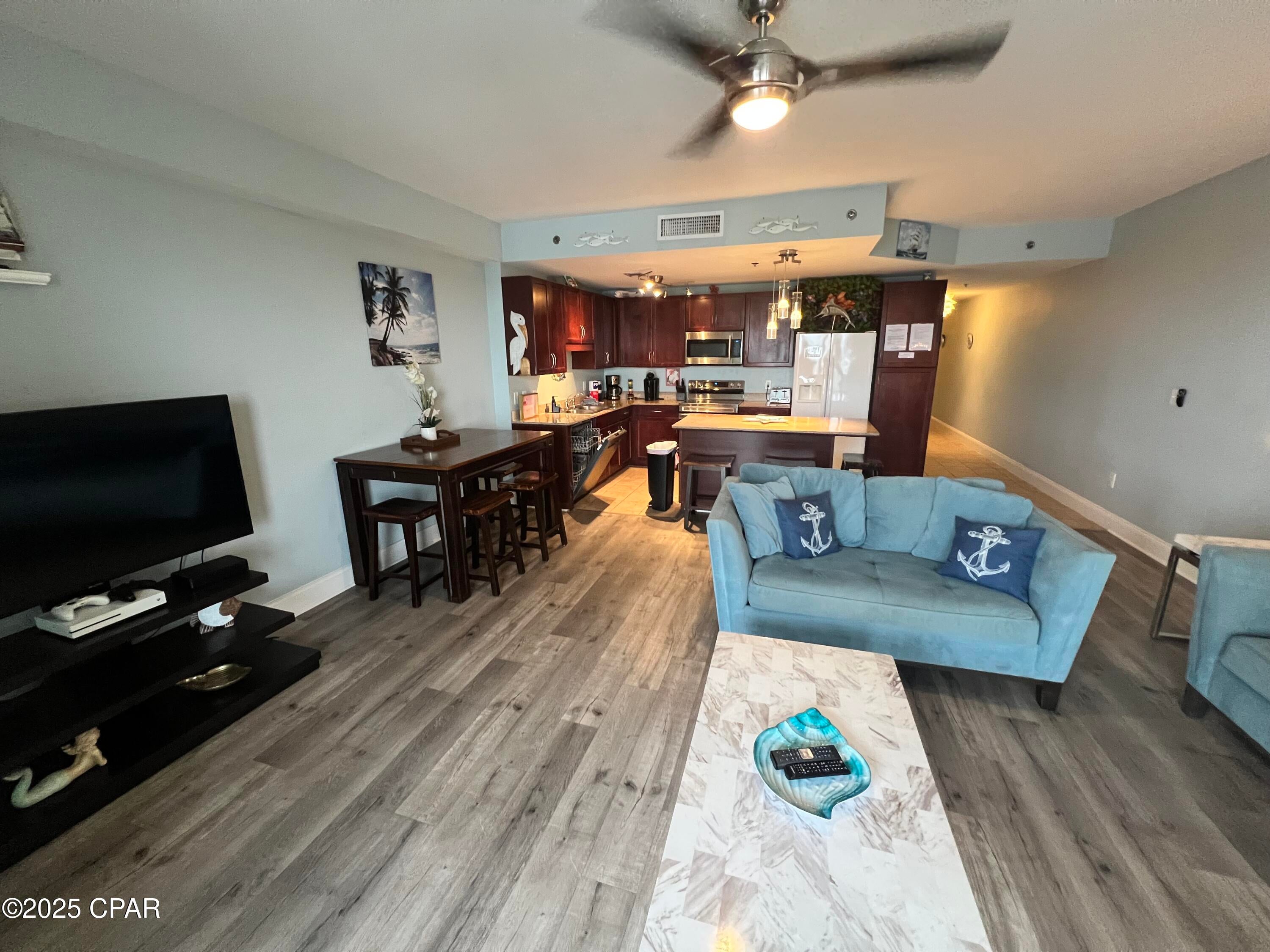 Welcome to your next home or investment retreat. Laketown wharf is known for its spacious units, great amenities and convenience to everything you need for a great vacation getaway. This unit is on the same floor as your parking garage access, which will save you and your guests time from those elevator wait times and get you to the beach or pools faster! Inside you will see nice updates,premium furniture,all major appliances including fridge and stacked washer & dryer and fresh decorations and clean paint throughout. This move in ready units is completely rental ready and is sold completely furnished! COA dues are paid quarterly and are among the most affordable on the beach. COA Dues include INSURANCE, Cable, Internet/WIFI, Water, Garbage, Mail Service, and all-access to property amenities, including 5 pools, pickleball court, boardwalk with restaurants and shopping, gated and security. Coded Gated Beach access, 2 parking garages. Truly a must see unit.