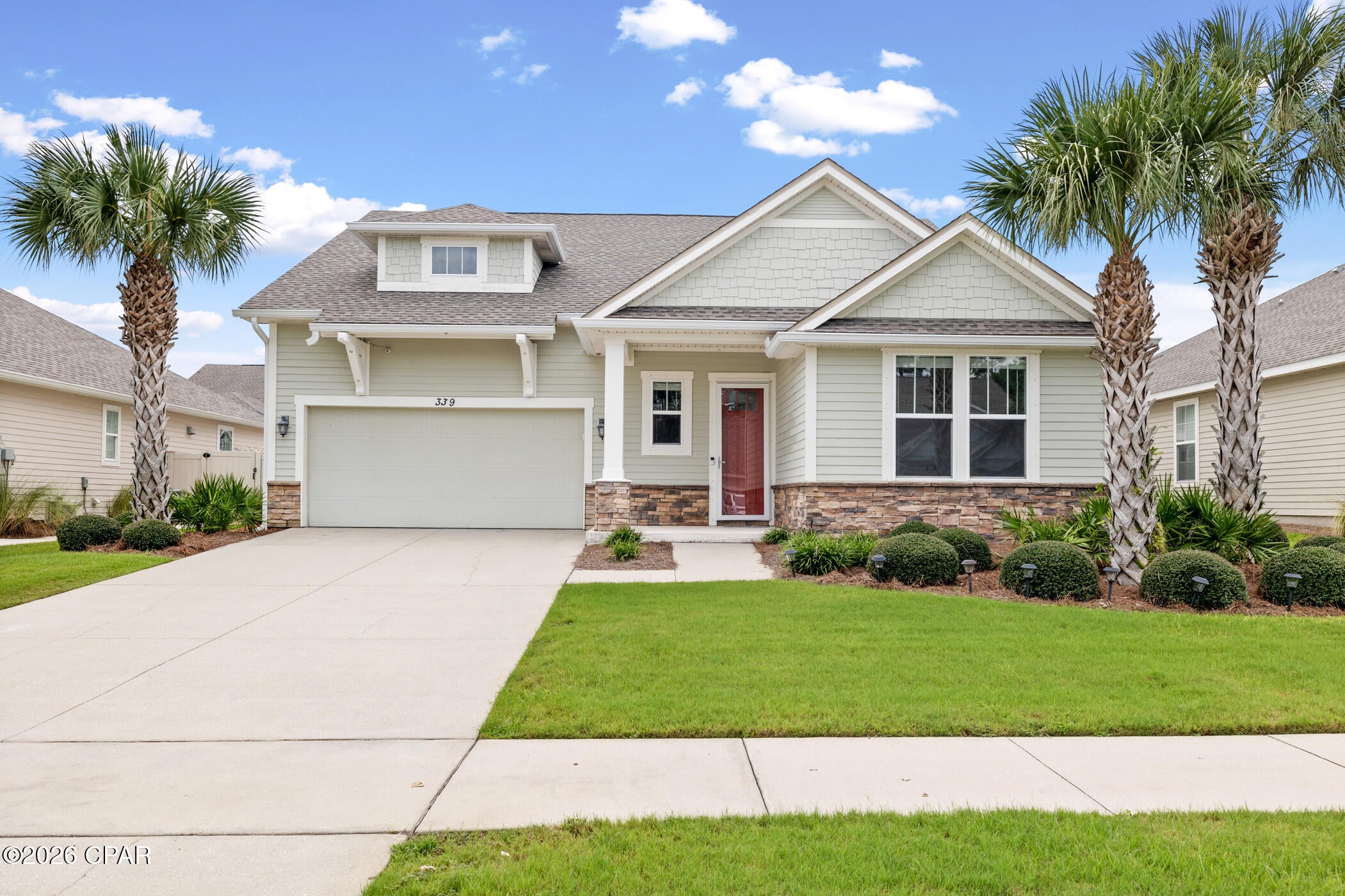 Welcome home to 339 Blue Sage Road, tucked inside the desirable Whisper Dunes community just half a mile from the Gulf. This craftsman-style home has been thoughtfully reconfigured from a 4-bedroom to a spacious and freshly painted 5-bedroom layout, offering flexible space for family, guests, or a home office. Recent upgrades include a new roof installed in 2022, along with all-new upstairs carpeting and new vinyl flooring in the downstairs bedrooms, kitchen, and hallway, all completed in June 2026. Step through the striking red front door into a bright, open entry featuring crown molding and warm wood-look flooring throughout the main living areas.

Whisper Dunes is a well-kept, deed-restricted community offering residents a refreshing pool, walking paths, and full lawn maintenance included in the HOA dues, providing low-maintenance living just minutes from Pier Park, local shopping, and dining, with the scenic 30A corridor also a short drive away.

Whether you're searching for a primary residence or a beach-area getaway, this home checks the boxes. The seller is motivated and open to creative terms. Bring your offer, and let's talk!