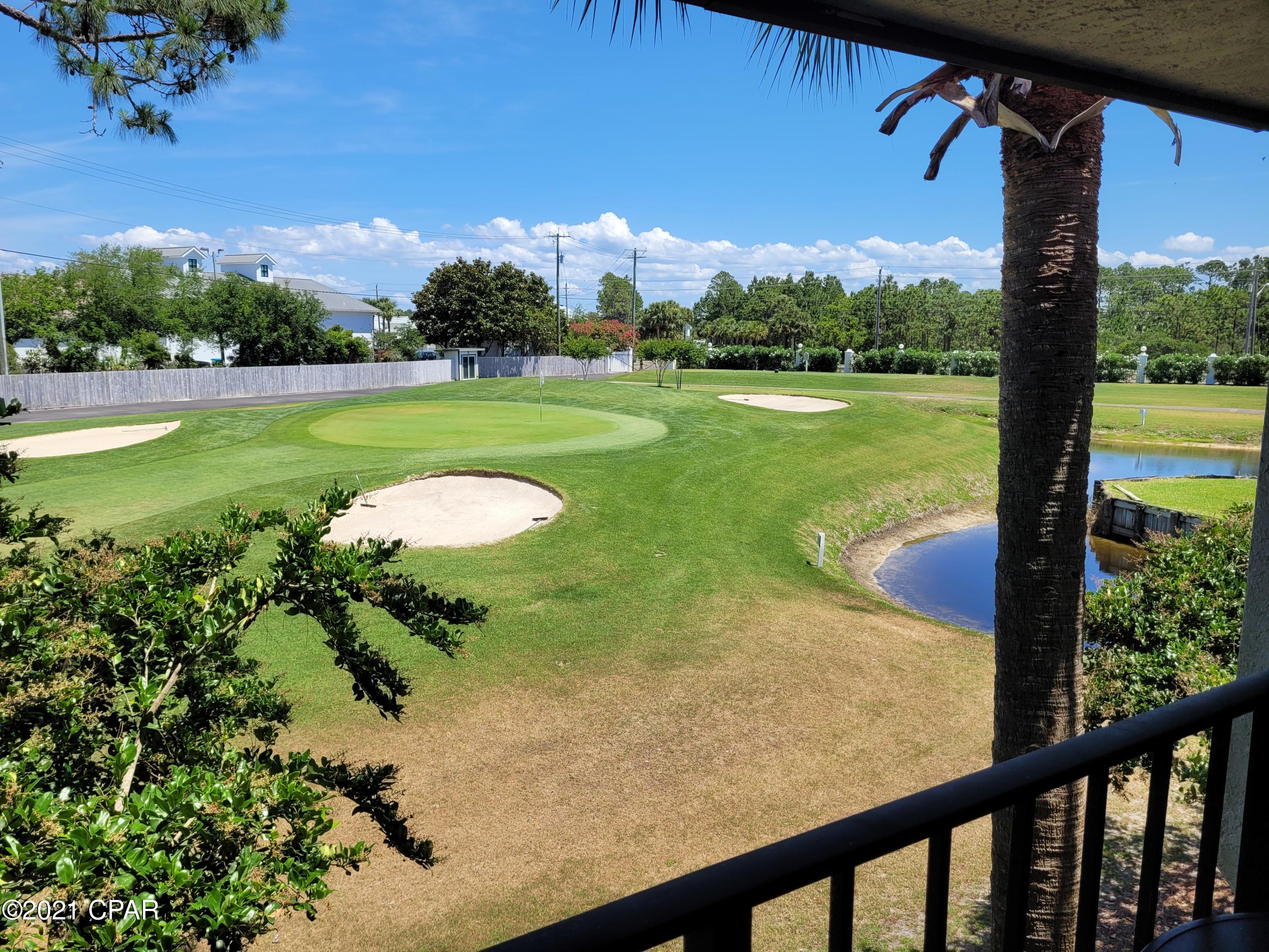 Under Contract- Taking Back up Offers. Updated! Pretty 2nd floor Villa with peaceful golf course view of Hole 3. Modern kitchen featuring granite, stainless, raised ceiling. New AC. Beautiful easy care wood flooring, wainscoting accent. Spacious private balcony full of coastal breezes and sounds of the gulf. Large Bedroom with its own bathroom. Nice furnishings and décor Rental Ready! Pet friendly for Owners! Steps to heated Villa pool. The beachfront amenities are a short walk or tram ride away: Beach Access, Tropical Pools, Hot Tubs, Sun Decks. Restaurant, Poolside Bar, Market, Pizza Shop. Kids Club with Splash Pad, activities. Owners play UNLIMITED Golf, Tennis, Shuffleboard. Fitness Center, Salon services. Gated Entrances, 24-hr Security.