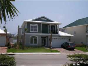 Beautiful 4 BR/3 BA across the street from the beach, sitting on The Lake at Summer Breeze.This spacious home has 10ft ceiling, 8 ft doors, travertine floors on entire 1st level, slate on all decks and balconies, granite countertops on all surfaces including bathrooms and web bar, custom cabinet with built ins around the fireplace, 2 air systems, upgraded stainless steel appliances, separate whirlpool garden tub and shower, private upstairs balcony off the master overlook the lake with incredible views. Unfurnished.