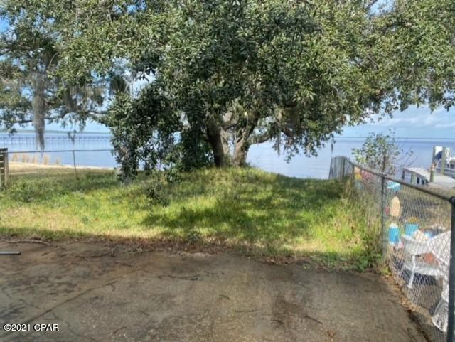Great find for this 3 bedroom 2 bath water front townhome located in Colony Club.  This home features a ground level master bedroom, vaulted ceilings in the living room with a triple sliding glass door leading to the back yard over looking West Bay.  This home also features a 2 car garage, tile floors, very large laundry room area that could also double as an office, and upstairs also has an oversized loft over looking the living room.