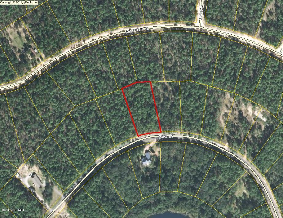 High elevated large wooded lot overlooking McCormick Lake! Short Walk to the clubhouse/beach on the lake across the street. Easy launching of a paddleboard, kayak or canoe! Only about 15 minutes South of Interstate 10 and about 40 minutes North of Panama City for Shopping, Restaurants, Entertainment, and Beautiful Gulf Beaches. As an owner in this development, you have access to Private McCormick Lake for Swimming, Fishing, Canoeing, Kayaking, etc. as well as the Main Lodge over on Compass Lake with Swimming Pool, Tennis Courts, Horseback Riding, etc. Come enjoy the Quiet Peaceful Lifestyle of Compass Lake in the Hills.