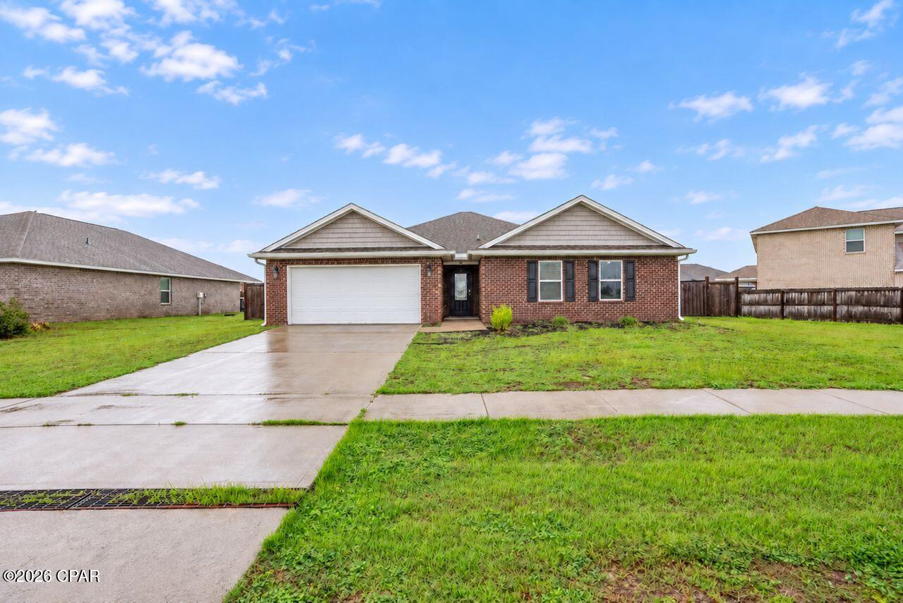 Take a look at this beautiful all brick home in the Hodges Bayou Plantation Subdivision near Lynn Haven.  This property  incorporates and open floor plan at 2326 sq feet, (builders plan), 4 bedrooms and 2 full bath.  Entering into the custom front door (upgrade), a large wide foyer greets you with elegance and traditional 8 foot ceilings and craftsmanship throughout. Large living room with abundance of natural lighting.  The ample kitchen overlooks the family room incorporating a breakfast bar/island.  Abundance of cabinetry and stainless steel appliances,to include a large walk-in pantry. You also have a formal dinning room for your family gatherings.  The master bedroom is on the other side of the home to give you additional privacy, large walk in closets, double vanity, soaking tub and shower.  The split bedrooms incorporate 3 additional bedrooms on the other side as one of the bedrooms can easily be converted into your home office.  All hallways and access areas are wide and can accommodate a handicap/wheelchair necessities.  Large laundry room and a two car garage. The back yard is fully fenced in and oversize covered patio.   Home is located minutes away from Lynn Haven, Highway 231, public boat ramp, and Panama City itself. Panama City Beach is close to 25 minutes for all your amusement needs.   Great schools and close proximity for your children (Southport and Bozeman).  Home is being sold under market value for a quick sale.