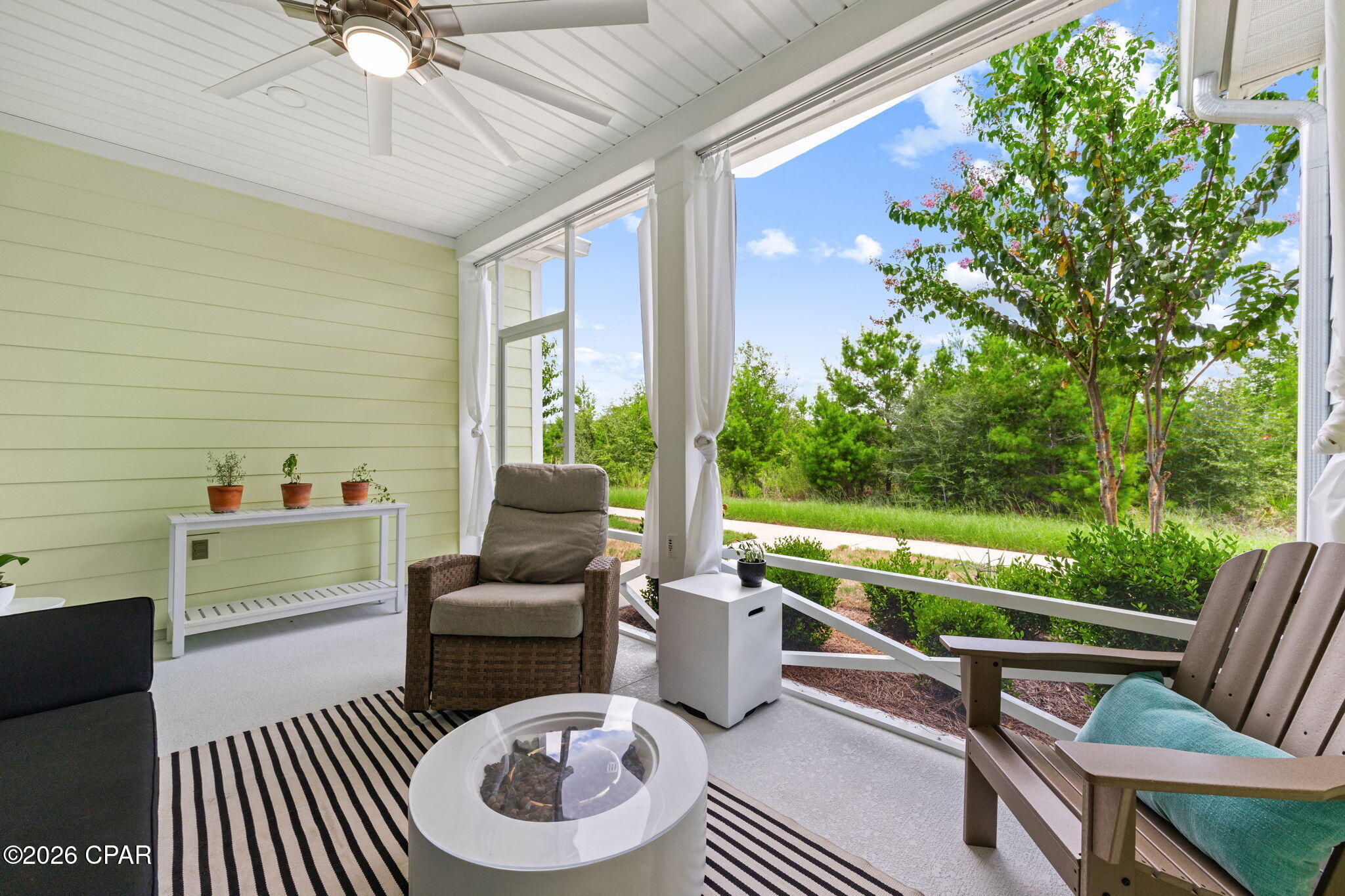 CAMELLIA COTTAGE in Phase 6BC of Latitude Margaritaville Watersound -- if a private cottage setting is high on your wish list, you may have found your spot.

Some homes are about upgrades. Some are about location. This one gives you both, but what may surprise you most is the privacy.

Sit down on the front screened porch and look around. You can't even see another home. While preparing this description from that very porch, I didn't see another person the entire time. Just trees, peace and quiet, and privacy that's difficult to find with a cottage. You may catch some morning sunshine, but by lunchtime the porch settles into shade for the rest of the day. Add a comfortable chair, something cold to drink, and your four-legged sidekick, and you may not want to go inside.

Eventually, though, you should -- because that's where the surprises begin.

This Camellia is almost like a game of hide-and-seek. The owners added custom touches throughout. Customized walls, clever storage and little extras appear around every corner. Open doors and pull out drawers -- there's always another surprise waiting.

The kitchen features custom cabinetry, beautiful countertops, designer backsplash, upgraded electric stove tastefully done. Open the lower cabinets and you'll discover pull-out shelving that makes everything easy to reach. And whatever you do, check out the pantry. There's a hidden surprise waiting for you.

The upgrades continue with beautiful flooring, cabinetry and countertops, custom lighting and ceiling fans. Metal storm shutters are also included to help protect the windows when needed.

The laundry room features aftermarket cabinetry for additional storage, and the refrigerator, washer and dryer may also remain with the home.

Then there is the garage -- because apparently they weren't finished upgrading yet. You'll find an upgraded epoxy-coated floor, ceiling fan and other extras that make this more than a place to park the golf cart.

And then there is *Phase 6BC.*

This location gives you privacy without putting you far from the action. Flip Flop Square, with green space, tiki-style pavilions, grills and neighborhood gatherings, is nearby. When you're ready for the bigger party, Latitude Town Square and the community's multimillion-dollar amenity complex are just a short golf cart ride away.

Here's something people who don't live here may not realize: from Phase 6, take the community pathway into Phase 4 and continue toward the amenity center without traveling along West Bay Parkway. It's one of those little conveniences that becomes a pretty big deal once you live here -- grab the golf cart and go.

And where exactly are you going?

Maybe it's Fins Up! Fitness Center, pickleball with friends, the resort-style Paradise Pool, indoor lap pool, dinner and drinks, or live music at Town Square. There are walking and biking trails, tennis, a dog park, clubs, activities and community events. Around here, filling your calendar isn't difficult. Leaving yourself a free afternoon might be.

The convenience outside the community continues to grow. The new Publix-anchored commercial area along Highway 79 is no longer just something on a drawing -- Publix is under construction and the walls are going up. Just a few miles down the road, construction on the new hospital is visibly moving forward.

And when the beach starts calling, the white sand and emerald waters of Panama City Beach are approximately seven miles away, as well as other popular Northwest Florida destinations within easy reach.

But here's the funny thing about this Camellia: after spending an afternoon on that private, shaded porch, you might not be in much of a hurry to go anywhere.

Privacy when you want it. Margaritaville when you don't.

That's a pretty good way to live.

Bring the flip-flops. Bring the golf cart. And definitely check the pantry.

Welcome home to your Camellia Cottage in Phase 6BC.