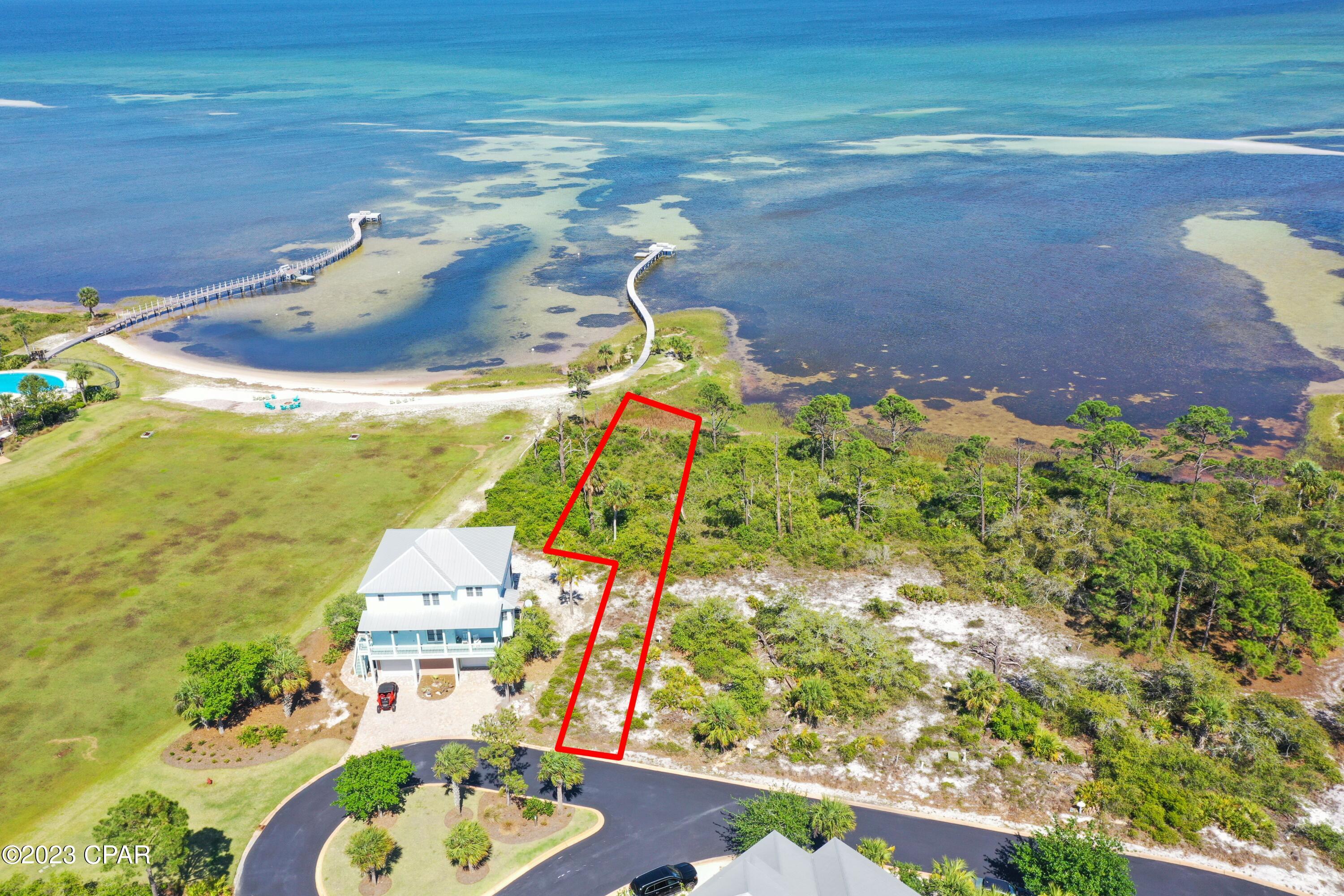 Fantastic bayfront lot in the premier development on Cape San Blas. This lot will have incredible views and it is close to the amazing bayside pool, lounge area, and fitness center. There are also tennis courts and a Gulf side pool in this gated development. This lot is approved for a private bayfront dock if desired. Seller also has custom house plans that seller would include with an acceptable offer. House plan is for a 4 bedroom/5 bath home with 3753 heated square feet.