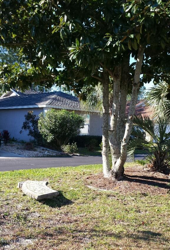 This beautiful stucco home is in excellent condition with almost new roof, carpet, paint, and appliances.  The gated subdivision has a club house, 2 pools, and other amenities.  The home is waterfront, with a pleasant area in back for grilling, reading, or just relaxing.  Easy to view!