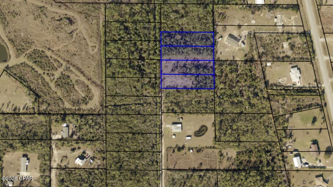Four adjacent lots offered together for $40,000, totaling approximately 2.064 acres. Each parcel is approximately 0.516 acres, providing ample space to build your new home in the Sandy Creek Country Club area. Enjoy peaceful country-style living with convenient access to Tyndall Air Force Base, restaurants, grocery stores, shopping, and other everyday amenities. Parcel IDs: 07399-327-000, 07399-310-000, 07399-31-0001, and 07399-327-001. Buyer to verify measurements, utilities, zoning, and intended use.