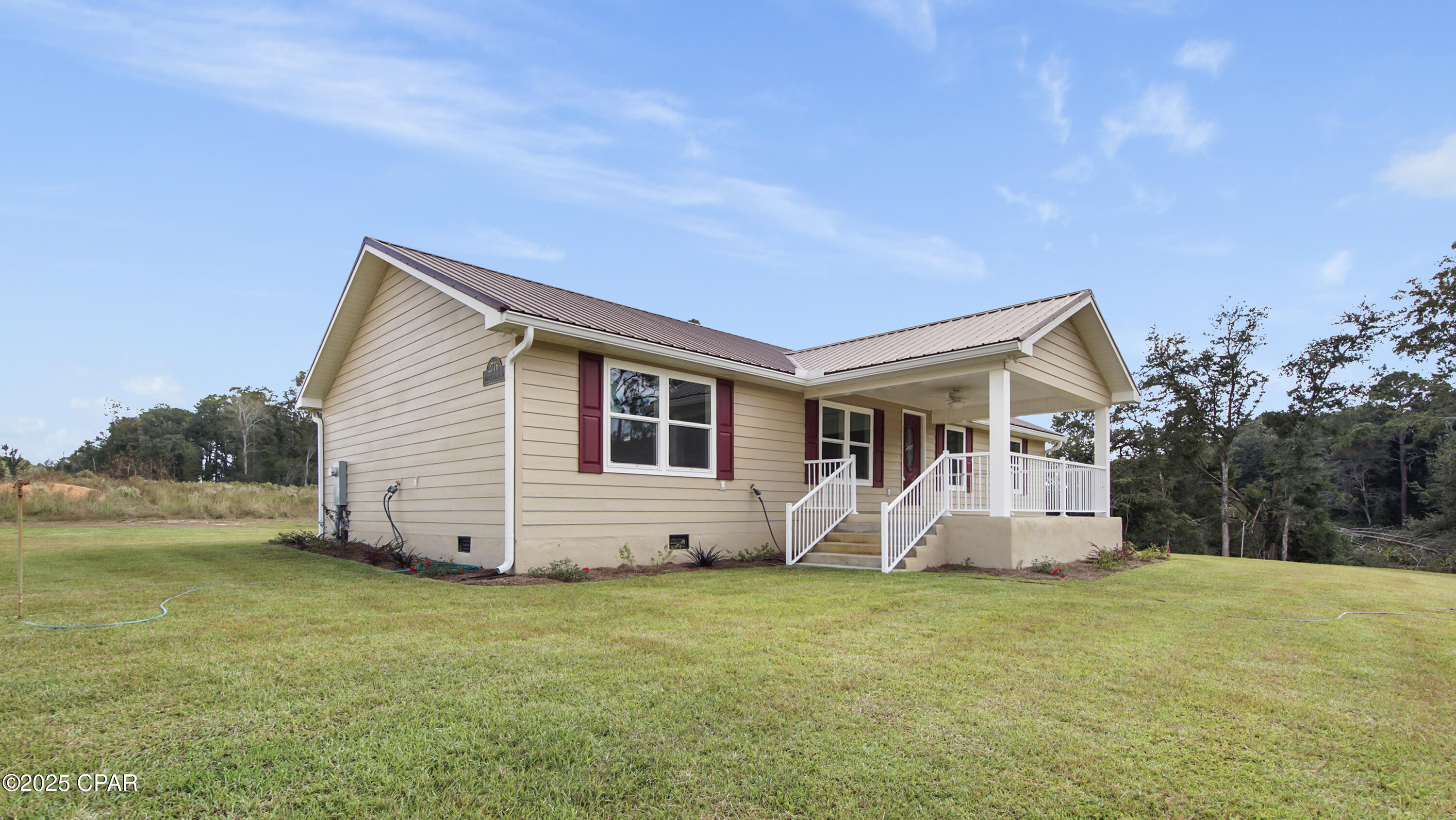 Discover comfortable, modern living in this newly constructed 3 bedroom, 2 bath home nestled on 1.17± acres in Bonifay, Florida. Designed with today's lifestyle in mind, this property offers a spacious layout, quality finishes, and the peaceful setting that comes with owning your own land — all in a location that keeps convenience within easy reach.
The impressive kitchen features sleek quartz countertops, a spacious center island highlighted by elegant pendant lighting, and a desirable gas range that will delight any home chef. Ample cabinetry and modern finishes ensure the space is as practical as it is eye-catching.

The primary suite offers a relaxing retreat, complete with dual walk-in closets featuring built-in organization systems to maximize storage. The en-suite bathroom is equally well appointed with a double vanity and a generously sized walk-in shower, providing a spa-like touch to your daily routine.

Two additional bedrooms offer flexibility for family, guests, or a dedicated home office. Step outside to enjoy covered front and back porches, perfect for outdoor dining, rocking chairs, or simply soaking up the expansive views and quiet surroundings.

Conveniently located less than an hour from the stunning white-sand beaches of Panama City Beach and the shopping, dining, and healthcare amenities of Dothan, Alabama — this home provides the ideal balance of privacy and accessibility.

Don't miss your opportunity to own a brand-new home on a spacious parcel of land in a growing area. Schedule your private showing today.

NOTE OF CLARITY: The Road has been marked as paved due to the fact a Construction Crew started the paving of the Road on 11/3/25. At the time of viewing you should notice Road Work leading to new pavement as a final outcome. Contact Homes County Bd of Co. Commissioners for verification.