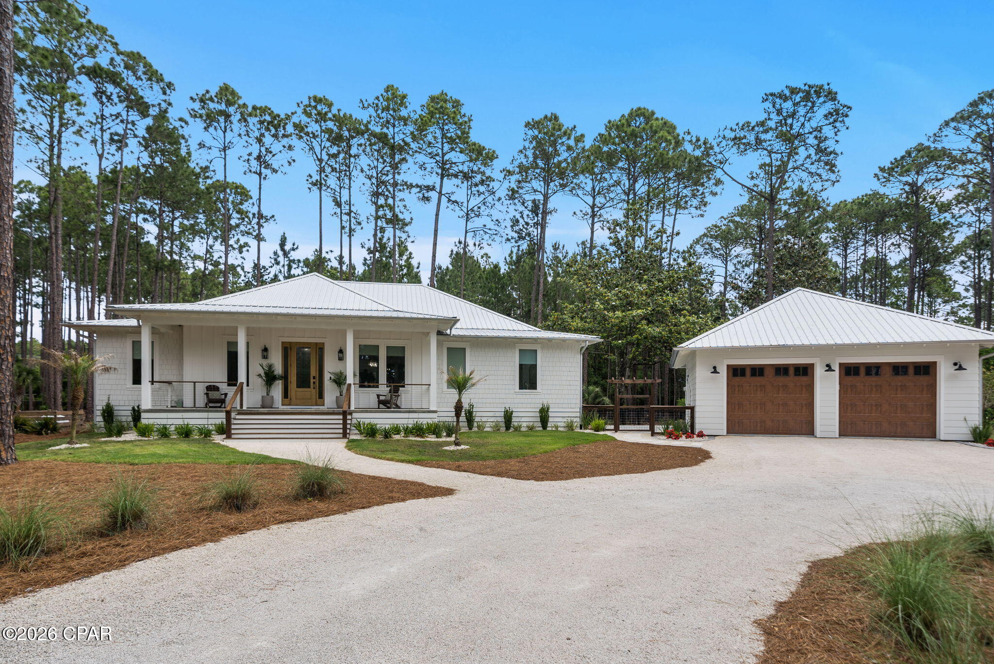 Tucked along a serene .79-acre homesite in one of Panama City Beach's most coveted gated communities, this impeccable 2024-built home with 3 bedrooms, 2 baths, home office and fully-insulated, heated and cooled 2-car garage was truly made for living. From the moment you arrive, every detail has been curated with intention, blending modern coastal elegance with craftsmanship that does not cut corners. Every inch of this home is custom and truly stands out amongst all others. 

Rare, single level living in RiverCamps has never felt this elevated. Ten foot ceilings in the main living areas give way to a dramatic vaulted living room anchored by rich oak beams, while coffered ceilings in the dining room add architectural warmth. White oak engineered floors flow seamlessly throughout and designer lighting sets the tone. A 12-foot, three-panel sliding door opens fully to a 40-foot screened porch overlooking the natural beauty of the Florida Panhandle, where deer are often seen in the backyard.

Built for performance, the home includes a whole-house generator, whole-house surge protector, tankless water heater, 250-gallon propane tank, Peel and Seal underlayment, Galvalume gutters with full drainage and foam insulation throughout. The detached garage features epoxy floors, beadboard walls, extended height 8-foot, insulated doors and attic access. This thoughtfully designed single-story home also features 3-foot-wide doorways, a seamless roll-in shower and a gently sloped entry ramp, all integrated with clean, modern finishes so the accessibility features feel like intentional design choices rather than an afterthought allowing you to enjoy life in your home for many years.

Smart home features include fiber internet, hardwired connections in every room, USB-C outlets, smart thermostats/dimmer lighting/appliances/security system and overhead reading lights in each bedroom. It's truly what's behind the walls in this home that are designed for living for years to come!

The kitchen is a true showpiece. A custom Venetian plaster range hood anchors the space above a professional LG and KitchenAid Pro Line appliance suite, complemented by a full height stone backsplash, Level 5 quartz countertops, Emtek hardware, Brizo plumbing fixtures, pot filler, glass rinser, appliance garage and maple floating shelves. A custom full height pantry with soft close drawers and butcher block countertop keeps everything organized. This space is designed for both everyday living and entertaining.

The private home office features 9-foot glass pivot doors, offering separation while maintaining an open feel. Three bedrooms, two baths and a well designed mudroom with built ins, bench seating and a custom dog wash station complete a thoughtful and functional layout.

The primary suite is a true retreat with a sitting area, fireplace and custom maple built in wall unit. The walk-in closet is a fully custom, solid wood system with natural light. The ensuite bath features a steam shower and sauna with LED lighting, a freestanding tub on a pedestal, fossil limestone flooring and marble mosaic tile with stone hardware throughout.

RiverCamps offers a lifestyle unlike any other and spans across more than 1,500 acres. Amenities include a resort-style pool with lap lanes and cabanas, complimentary boat storage (hello, savings!) and launch, creek access with slips, kayaks and paddleboards, a pier, pickleball courts, stocked fishing ponds, fire pit gathering area and over 15 miles of scenic trails. The RiverHouse, social lounge, community events and campground create a true sense of community. A new fitness center is expected Fall/Winter 2026.

6331 Turkey Cove Lane is move in ready, meticulously maintained and offers a rare combination of custom design, quality and lifestyle. A full list of features and benefits available by request. Schedule your private tour today!