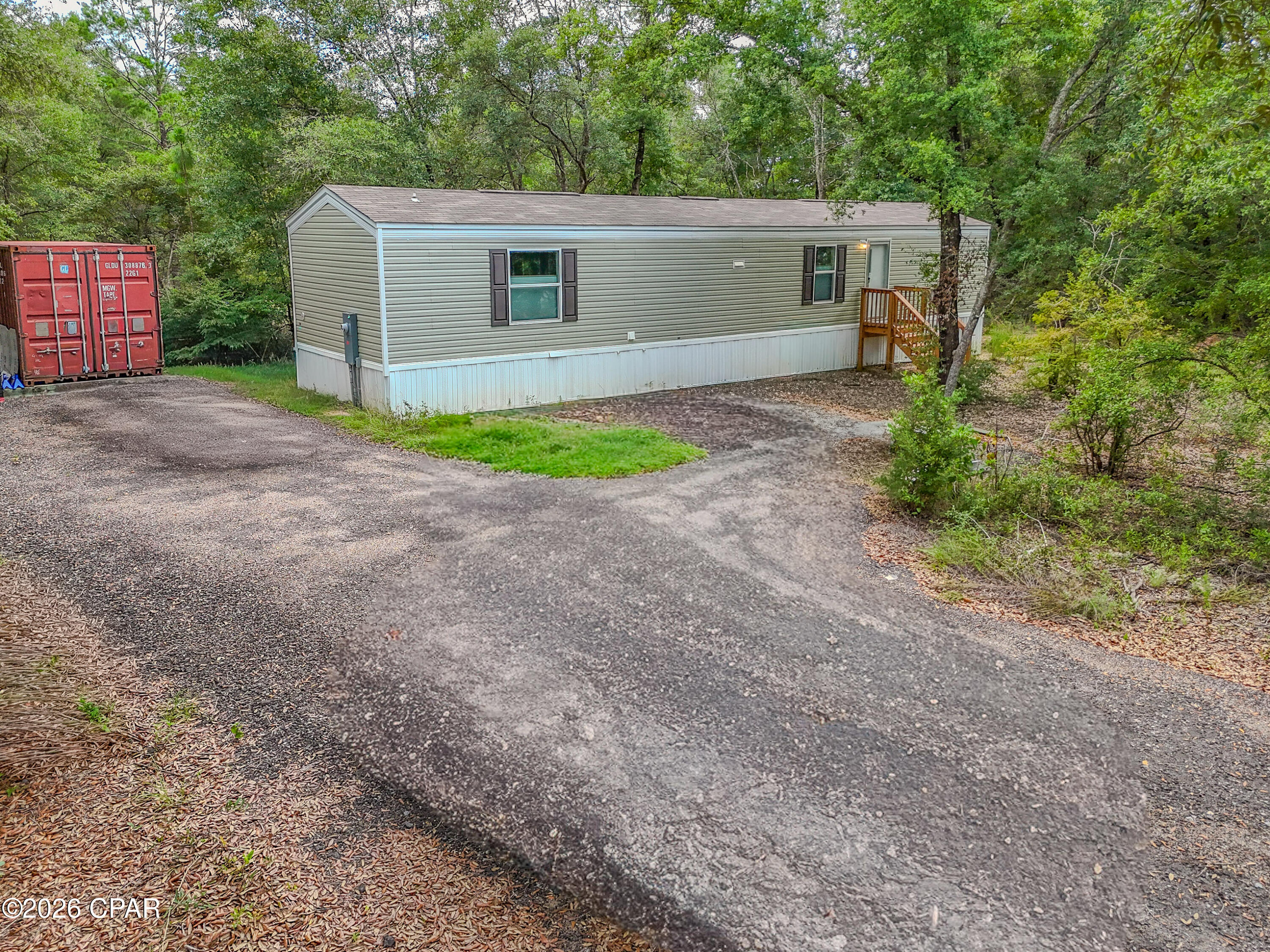 **Price Improvement + $5K toward Buyer closing costs and prepaids**

Looking for country living with all the hard work already done? This beautiful 3.94-acre property is move-in ready and packed with upgrades!

The property features a like-new 2024 Southern Energy 14x60 manufactured home offering 2 bedrooms and 2 bathrooms. In addition, you'll find a new well, new underground power, and a septic system sized for a future 3-bedroom, 3-bath home--giving you room to expand.

A 75-foot milled asphalt driveway leads you through a large farm gate to the property, providing both convenience and privacy.

The standout feature is the newly completed 20-foot insulated container workshop, complete with air conditioning, a man door, finished wood interior, 100-amp electrical panel, overhead lighting, exterior light and outlet, built-in workbenches, and six conveniently placed electrical outlets. A well pump house adds even more functionality.

All furniture and machines/tools convey with an acceptable offer.

Whether you're looking for a peaceful homestead, weekend retreat, or property with room to grow, this one checks all the boxes.