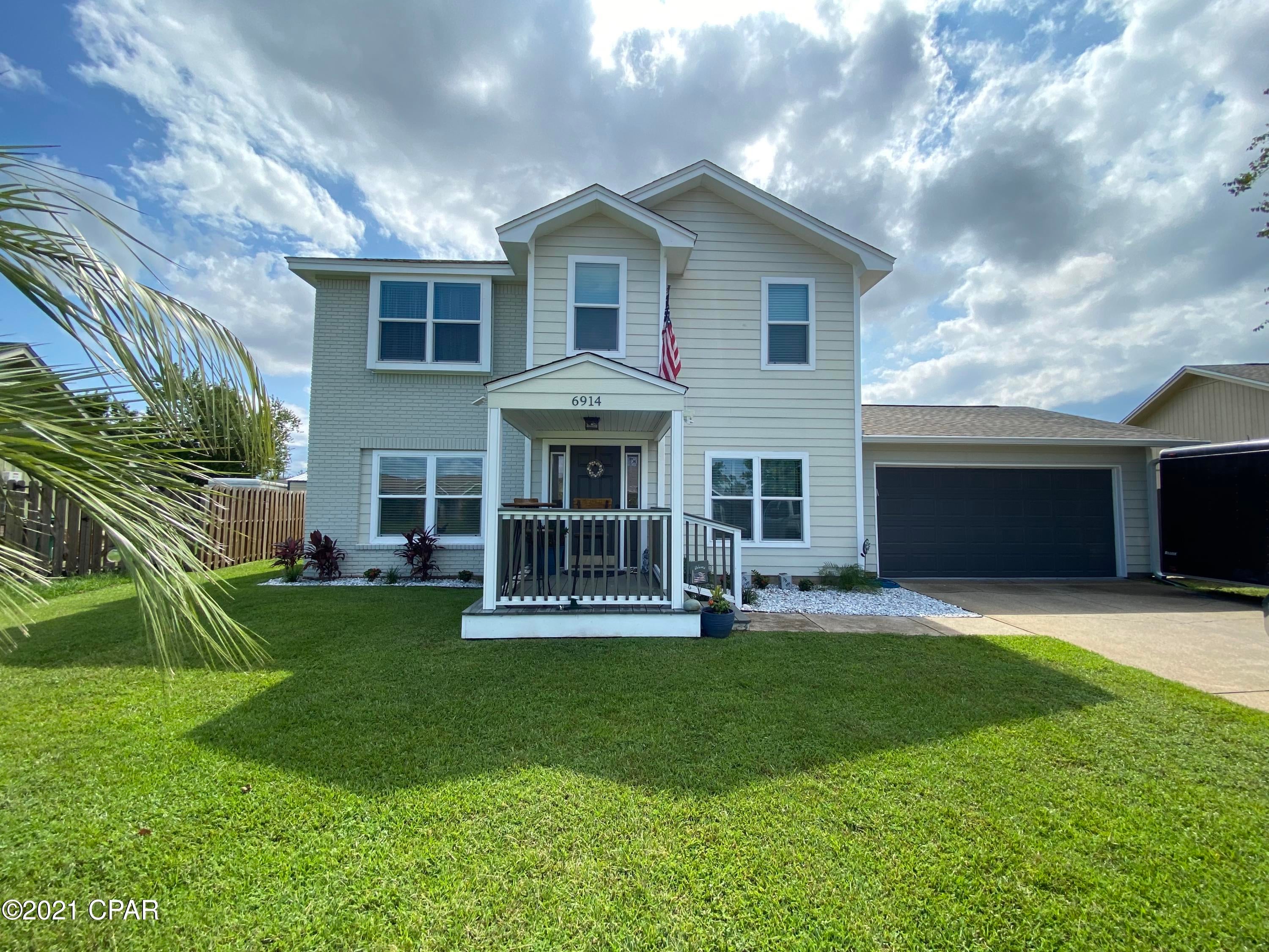 Take a look at this charming 3 bedroom 2.5 bath, 2 story home. Kitchen is updated with LVP flooring, Granite countertops, tiled back splash and stainless steel appliances. Living room is spacious with a custom gas fireplace and LVP flooring. Off the back is a Screened in porch looking into a well maintained yard with matured trees and a few fruit trees. Upstairs you will find the 3 bedrooms. The Master has a walk-in closet and custom tiled shower. All bathrooms have granite countertops and LVP flooring. The parking features a Two car garage with front and back garage doors, easy to pull right into the back yard. Call your Realtor today to schedule a showing!