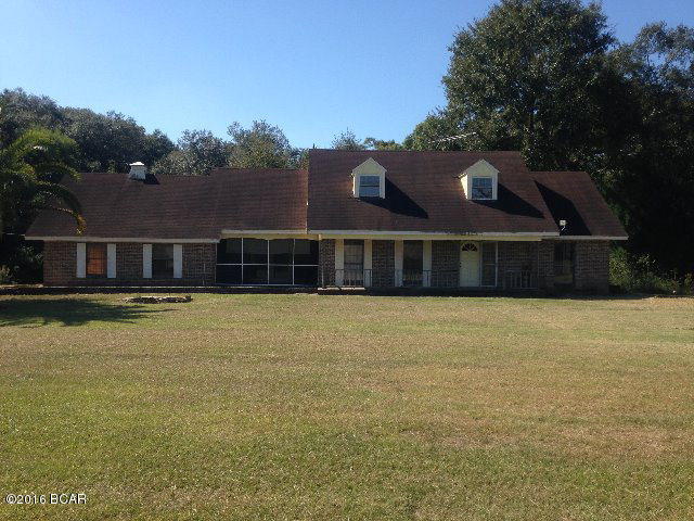 This 4 bedroom 2.5 bath country style home sits on over 6 acres and is priced for quick sale. On the first level you will find the master bed/bath, family room, formal dining, half bath and kitchen that overlooks the living area with fireplace. On the second level are 3 additional bedrooms that over look the property and an additional full bathroom. House also features garage, front porch and screened in back porch. Outside you will find a 6 stall horse barn. Additional acreage is available.