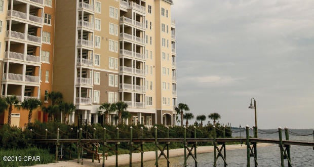 Live on Beautiful St. Andrews Bay with your own private balcony overlooking the sparkling waters and jumping dolphins as you watch the mystical sunsets!  This unit is located on the west side of the project and offers breathtaking views of St. Andrews Bay and Shell Island.  It is surrounded by St. Andrews Marina on one side and beautiful Oaks by the Bay Park on the other side.  Amenities include a swimming pool, club house, exercise room, covered parking garage and landscaped common area on top.