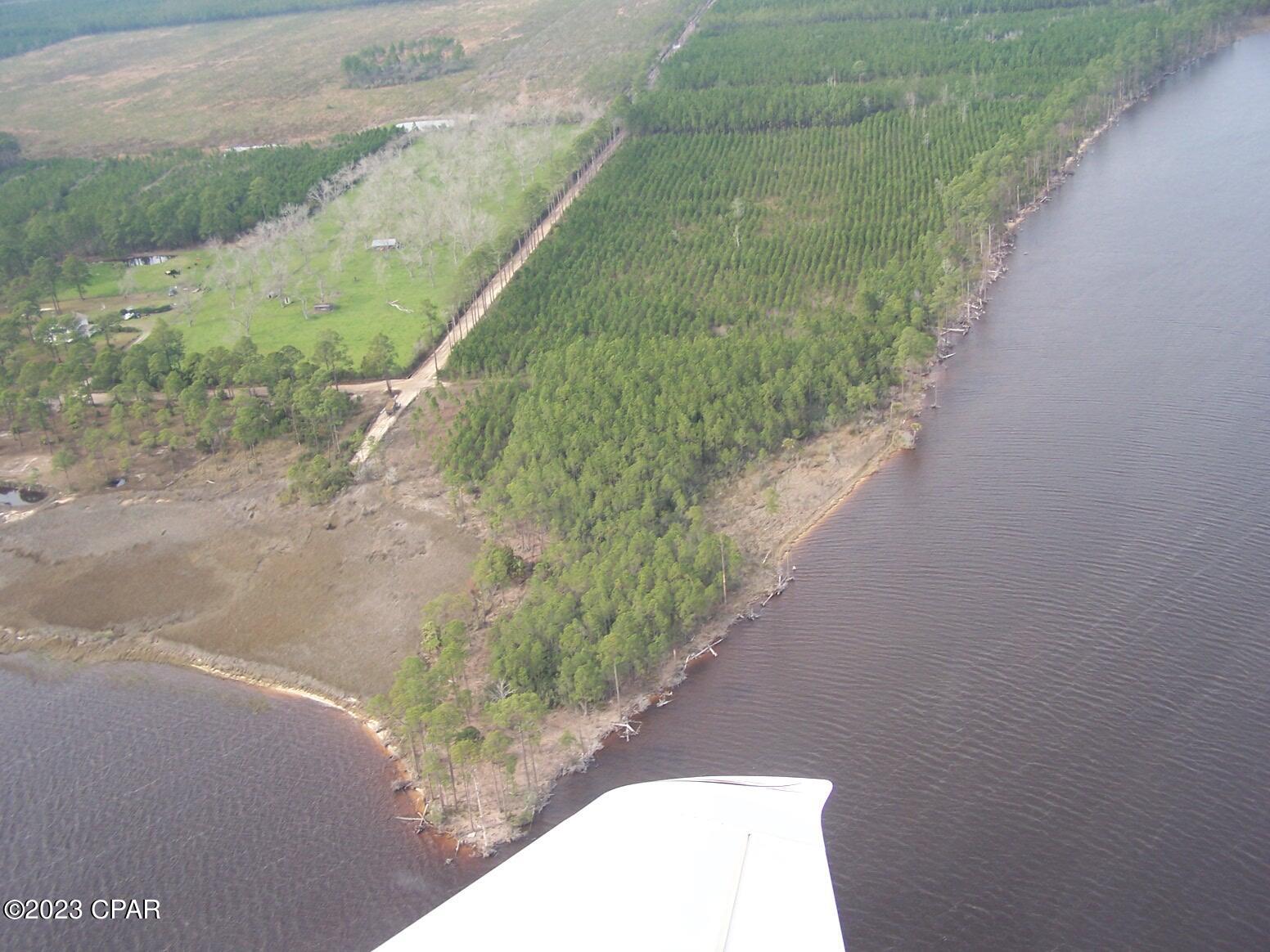 Zoning is 2 units per acre. This serene piece of pristine coastline covers 167 acres in Panama City, Florida, with its approx. 7200 ft (1.3 miles) of shoreline on the Intercoastal Waterway. Located a leisurely boat ride away from the Gulf of Mexico, in the East Bay area, this tract of land is ideal for a waterfront community. This amazing parcel of land is one of the best and most stunning pieces of land with deep water accessibility left in Panama City, Florida with huge potential for development. There are engineering and feasibility studies completed in the past and this property could have 173 up to 232 lots per these studies. There is a complete packet of information on file, along with survey, wetland delineations, and lots of photos.