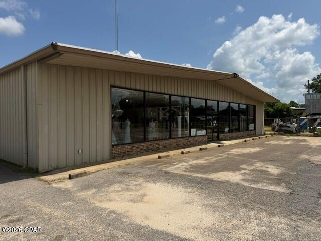 Prime Highway 90 Commercial Property. Excellent opportunity to own a highly visible commercial property located directly on Highway 90 in Bonifay. This established commercial location offers convenient  access, excellent road frontage and a versatile setting suitable for a variety of business, service, retail, contractor or investment uses. Large metal building has retail space and warehouse space along with several other storage structures on the property. Convenient access to downtown Bonifay, Interstate 10 and surrounding communities. The property has plenty of building and land space for businesses needing a combination of office/retail presence, equipment access and operational space with plenty of room for expansion. Whether you are looking to relocate or expand an existing business, establish a new commercial operation, or add an investment property to your portfolio, this is an outstanding opportunity in the heart of Holmes County.

All sizes are approximate so interested parties should verify if important.

Listing also Includes parcel 0936.04-002-000-001.200 to the east of main parcel
