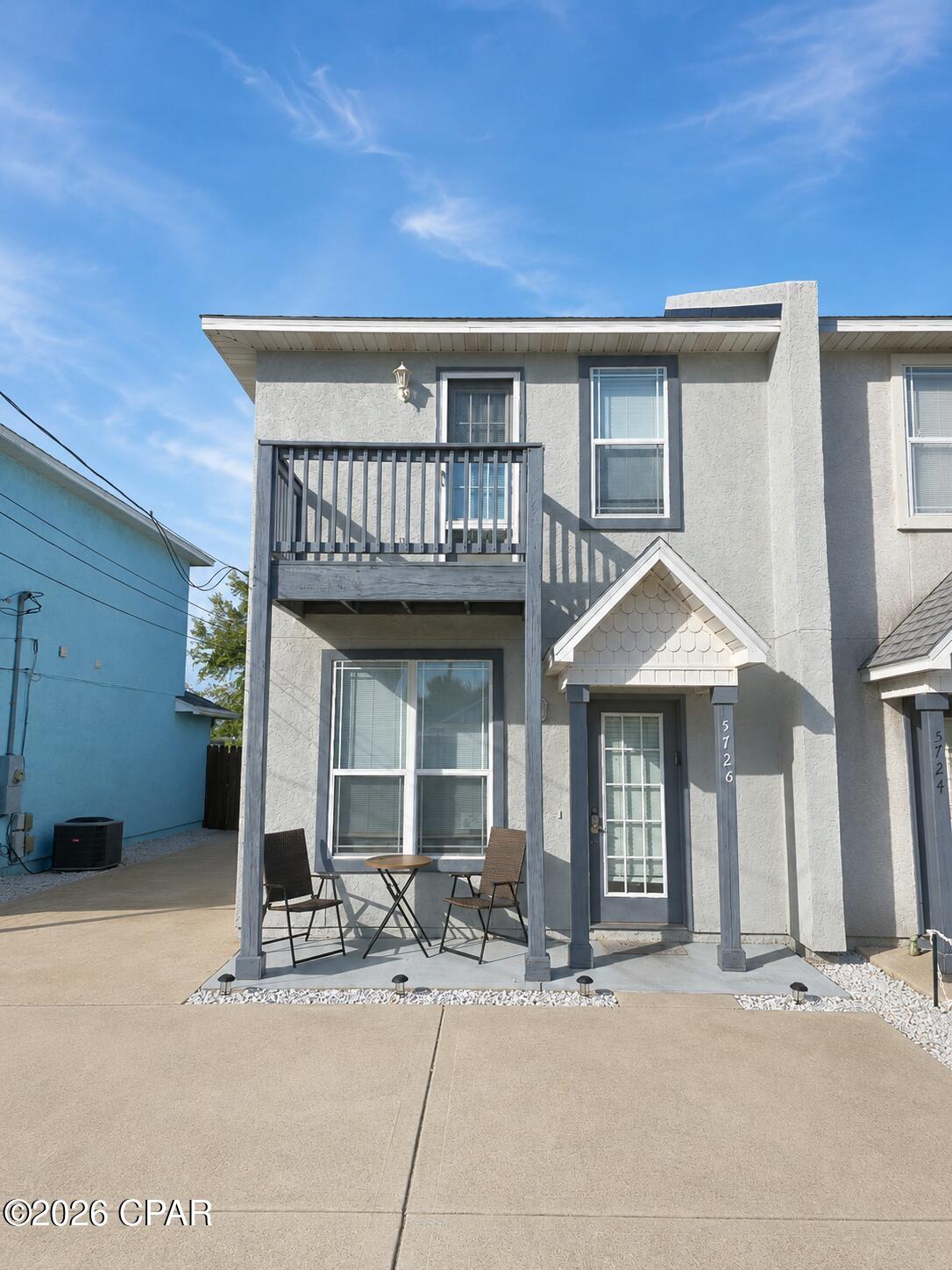 Updated 2BR Townhome with Fenced Yard Near Beach Access
Enjoy Panama City Beach living in this inviting 2-bedroom, 2.5-bath townhome offering 1,158 square feet, a private fenced backyard, and close proximity to public beach access. Available furnished or unfurnished, allowing you to choose the option that best fits your needs.

The main level features a bright living area, dedicated dining space, and an updated kitchen with white shaker-style cabinetry, granite-look countertops, and stainless steel appliances. Wood-look flooring runs throughout for a clean, cohesive look.

Upstairs, both bedrooms offer comfortable space, full bathrooms, and generous walk-in closet storage. A dedicated in-home laundry area with washer and dryer adds everyday convenience.

Outside, relax or dine on the covered patio overlooking the fully fenced backyard. The home also includes a front balcony and driveway parking. Located approximately a four-minute walk from Beach Access 11, this townhome offers an easy Panama City Beach lifestyle.