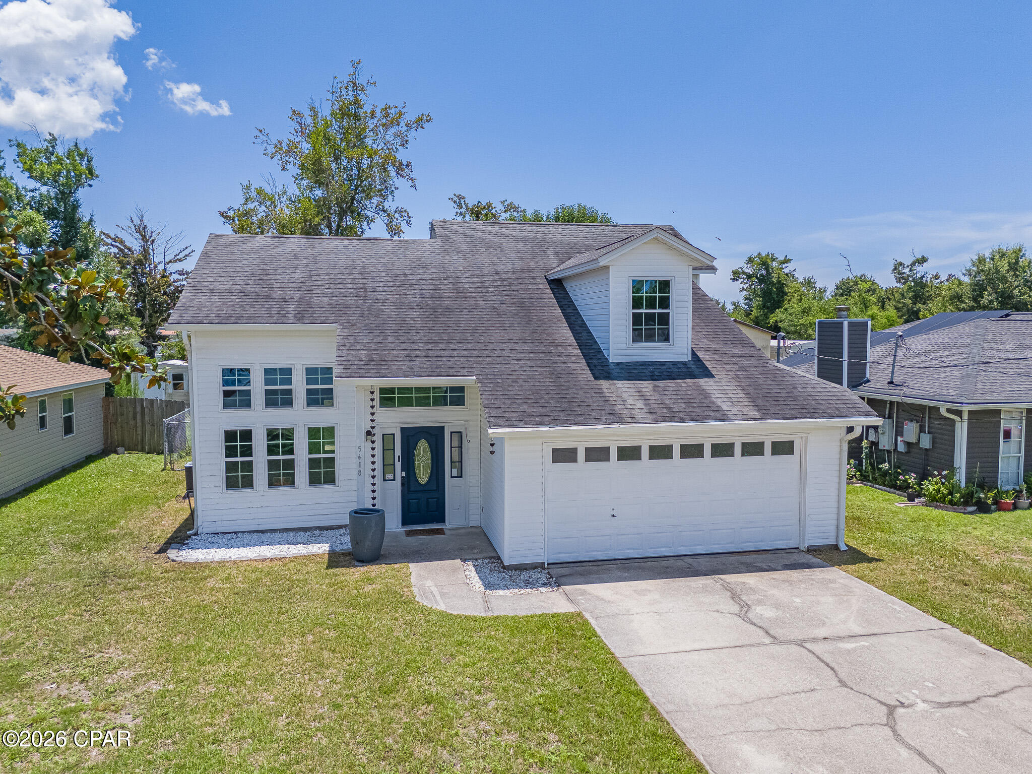 Welcome home to this charming 3-bedroom, 2-bath residence conveniently located just minutes from Tyndall Air Force Base. Situated on a spacious 0.30-acre lot, this property offers plenty of room to enjoy outdoor living while being surrounded by beautiful mature trees that provide shade, privacy, and natural beauty.

Inside, you'll find a comfortable and functional floor plan designed for everyday living. Interior features beautiful vaulted ceilings and multiple large windows that provide great natural lighting with durable hardwood plank tile. First floor features a bedroom as well as a full bath. Make your way upstairs to the second guest bedroom with quaint window nook. Just down the hall is the master bedroom with two closets.

Enjoy the convenience of nearby shopping, dining, schools, and easy access to local beaches, all while living in a peaceful residential setting. Don't miss your chance to own this well-located home with space and endless potential.

All sizes/measurements/information are approximate, buyer/buyer's agent responsibility to verify if important.