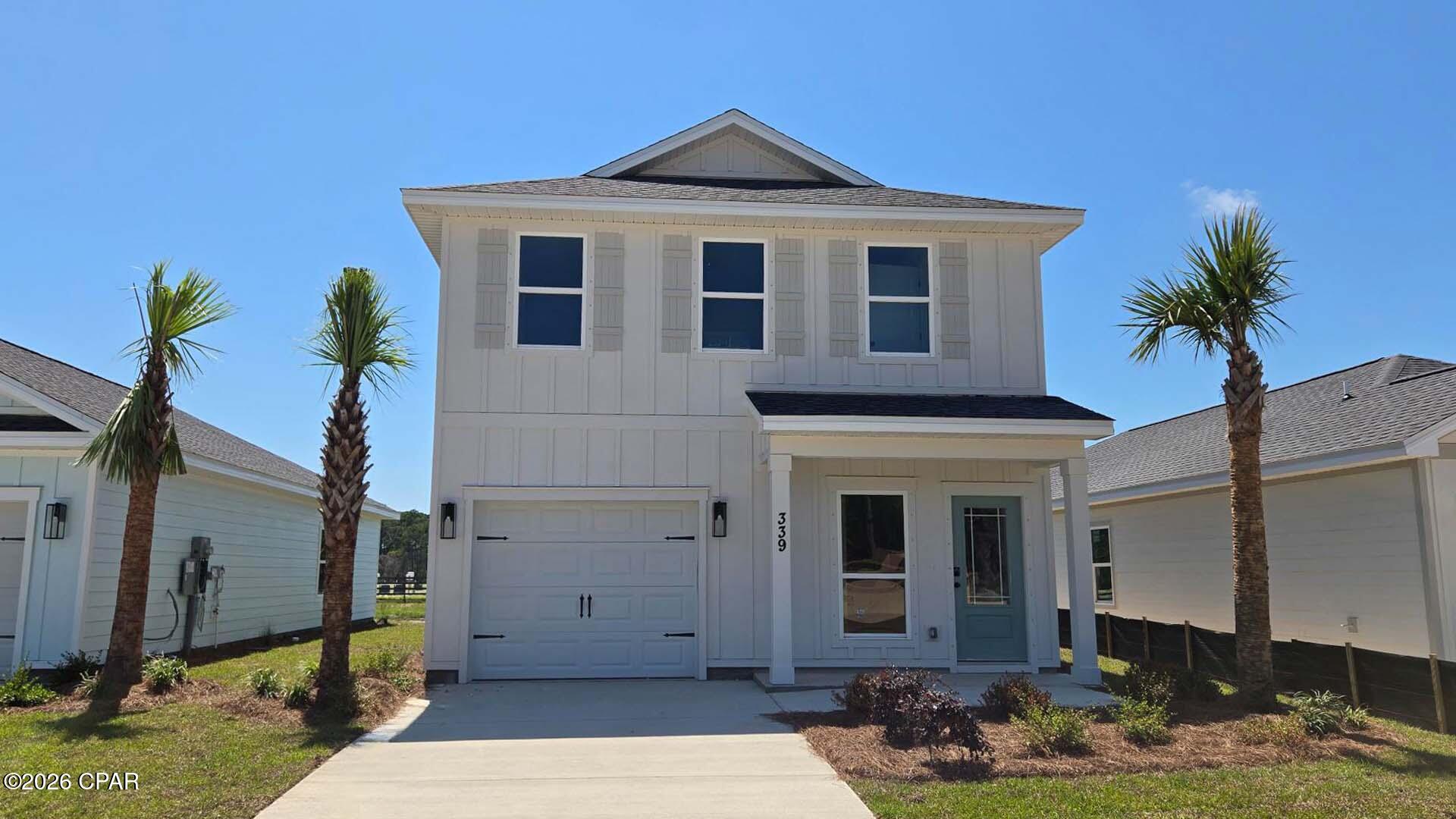 Welcome to 339 Robinson Bluff Road, a new home at Colonial East in Panama City Beach Florida. This home is ready for move in and features a grand entry with stairs leading to the second level bedrooms and a hall leading to the spacious downstairs living area. The foyer offers a coat closet and garage access just off the entry and a powder room. As you enter the open living area you will find an open kitchen with peninsula bar and space for bar seating. The dining area is spacious and looks over to the living area. The main living area serves as the heart of the home, as all bedrooms are on the second level.

The stairs located off the foyer lead to a second level landing and hall with all bedrooms and a laundry area. The primary bedroom is located just off the landing and overlooks the back of the home. This space is the perfect retreat and has a large closet and private ensuite bathroom with a large soak tub and separate shower as well as a dual sink vanity.

Leaving the primary bedroom, you will find two additional bedrooms that feature a Jack and Jill bathroom with separate single sink vanities and a shower tub combination. The additional bedrooms are spacious and feature large closets for storage.