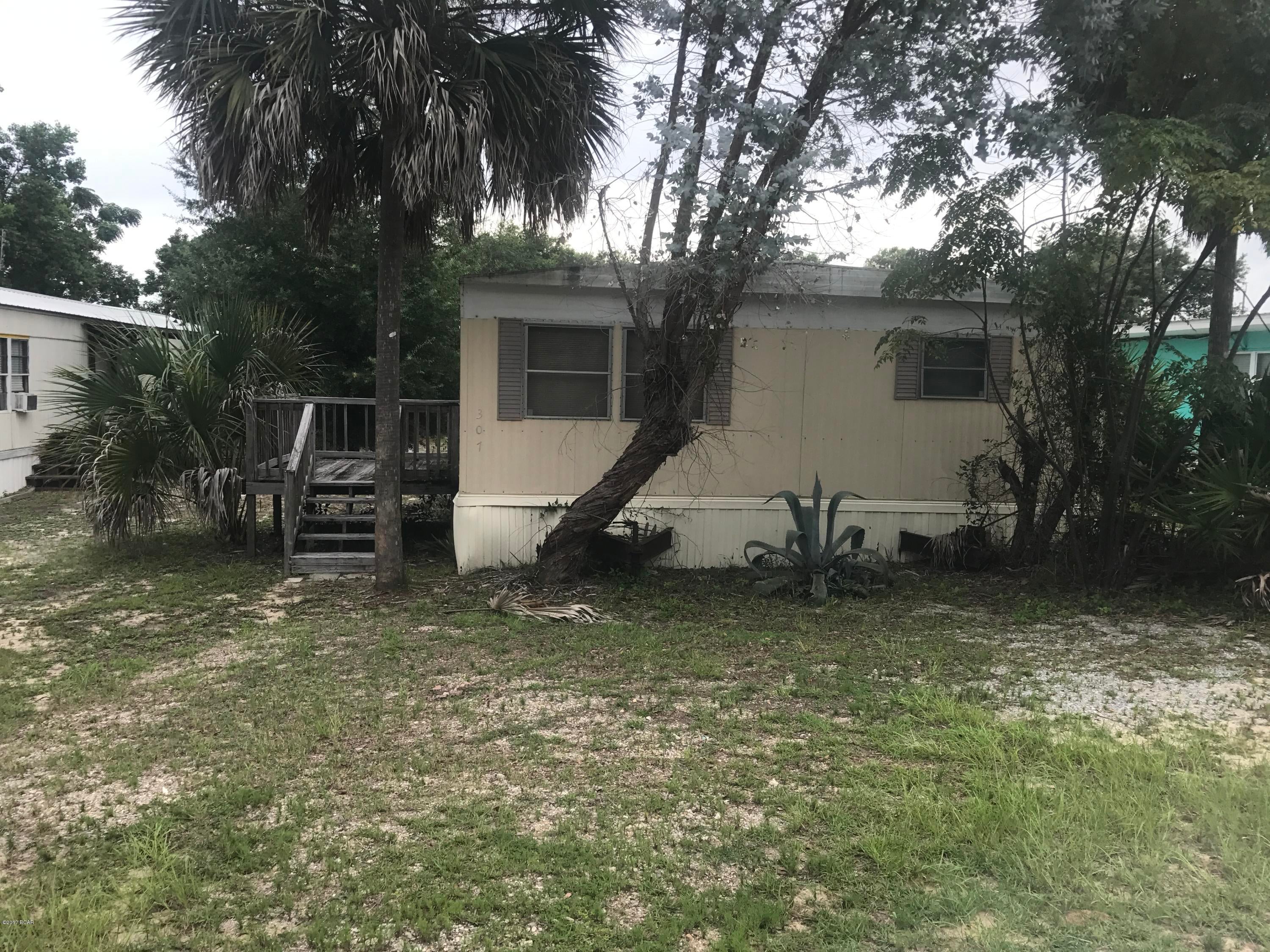 NICE LOT 4 BLOCKS FROM FRONT BEACH ROAD.  THIS LOT HAS A DOUBLE WIDE MOBILE HOME ON LOT.  THE MOBILE HOME HAS NO VALUE THEREFORE THE LOT IS BEING SOLD AS IS WITH THE DOUBLE WIDE ON LOT, AND BEING SOLD AS A VACANT LOT.
