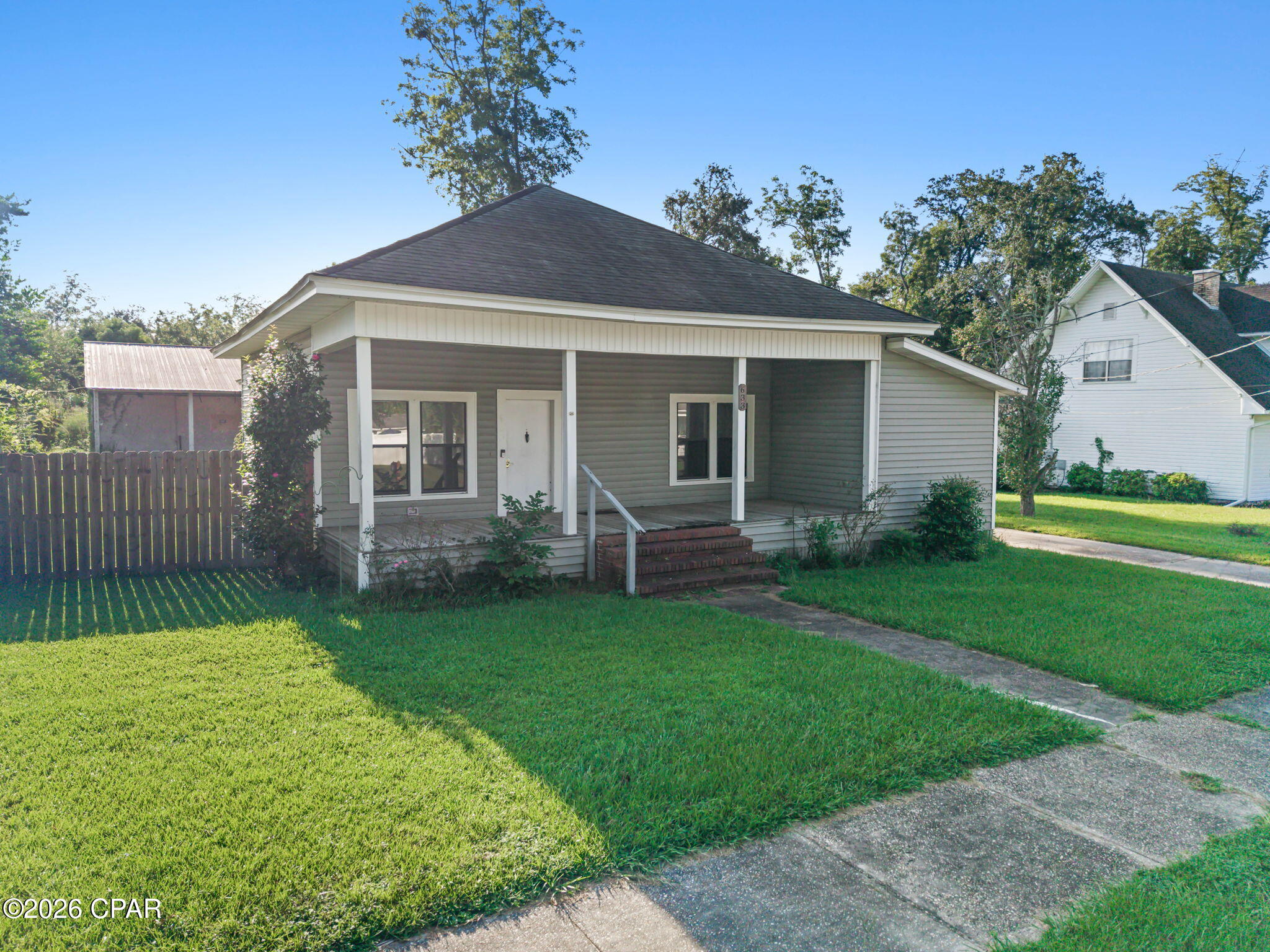 Calling all investors, renovators, and buyers ready to bring a home back to life! This 3-bedroom, 2-bath home offers a great opportunity for someone with vision to renovate, update, and make it their own. Features include multiple living areas, a dedicated dining area, functional layout, and plenty of natural light throughout. The kitchen offers a generous footprint with room to redesign and update to your style, while the three bedrooms and two full baths provide a solid foundation for creating a home that feels completely your own. Outside, the covered front porch adds classic Southern charm and offers a welcoming place to relax. The property also includes a large detached workshop with additional covered space, giving you plenty of room for storage, projects, equipment, or hobbies. Conveniently located near downtown Chipley, you'll be just minutes from local restaurants, shopping, schools, parks, and everyday conveniences. Whether you're searching for your next renovation project, investment opportunity, or a home you can customize from the ground up, this property is ready for someone to bring fresh ideas and new life to it!