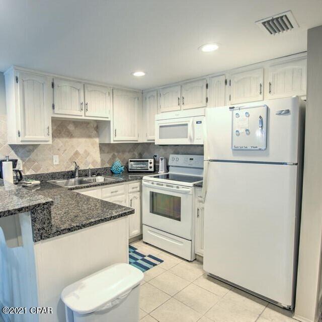 This is a full two bedroom 2 bath 2nd floor condo at Sugar Beach Condominiums. Completely furnished and ready to enjoy or rent. You will be able to park right outside your front door. Sugar Beach is a gulf front complex and C41 offers both lake and gulf views with landscaped grounds that make this quite the oasis. Plenty of amenities with large pool, tennis courts, shuffleboard and large clubhouse sporting large tv and kitchen.