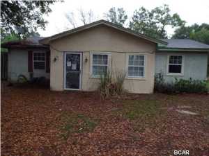Great Bargain.  Starter block 3 bedrooms, 2 baths home needing some TLC, on an acre of land off a private dirt road offered as is. All sizes are approximate please verify accordingly.