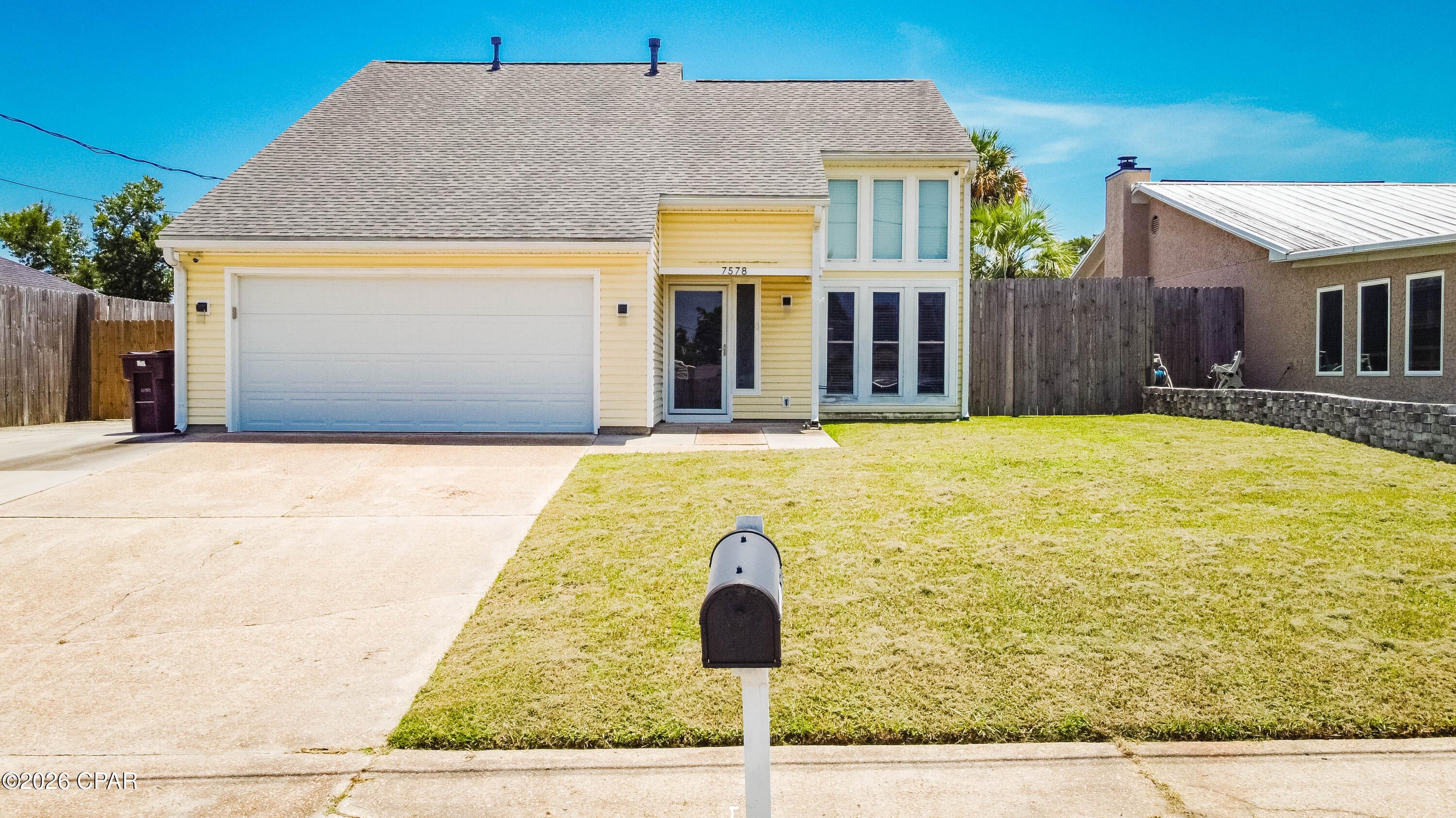 Come see this beautiful 2 story home with an air-conditioned yard building in Panama City.  This 0.17 acre property showcases a fenced back yard with a new gate, a large screened in porch, additional driveway parking and a spacious yard building with additional storage space & AC that could be used for a workshop, craft room, or cater to the buyer's needs. The 1,766 sq ft home features tile throughout, three bedrooms with two being on the second floor, a kitchen that includes all stainless appliances, under cabinet lighting and abundant cabinet space, as well as a living space that features high ceilings providing a ton of natural light from the floor to ceiling windows.  The property is located 2 miles of the Callaway Recreational Complex & Arts & Conference Center and within three miles of a Walmart Supercenter and additional shopping/restaurants off of US-98.  This property is only 9 miles from Tyndall AFB.  Schedule your showing today.
