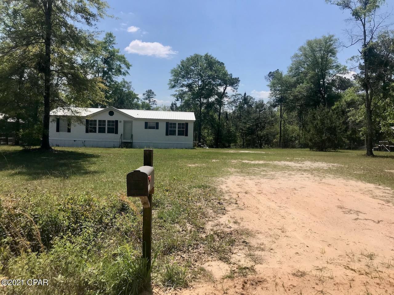 Nice home on an acre of land, not too far down a quiet county maintained dirt road. New metal roof and new 4 ton heating and cooling unit, new skirting, and some new flooring as well. Located about 5 miles north of Bonifay, Florida and an hour North of the Gulf of Mexico and South of Dothan, Alabama.