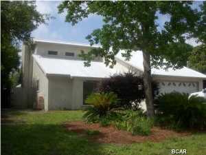 This home is located on the South side of Hwy 98 just a short golf cart ride to the beach. It is 3 bedrooms, 2 bath, wood burning fireplace, high ceilings in the living room, screened porch, inground swimming pool. There is a whole house water filter system that is not connected but could be hooked back up. A separate storage building for additional storage. Could use a bit of updating but has been kept in good condition.