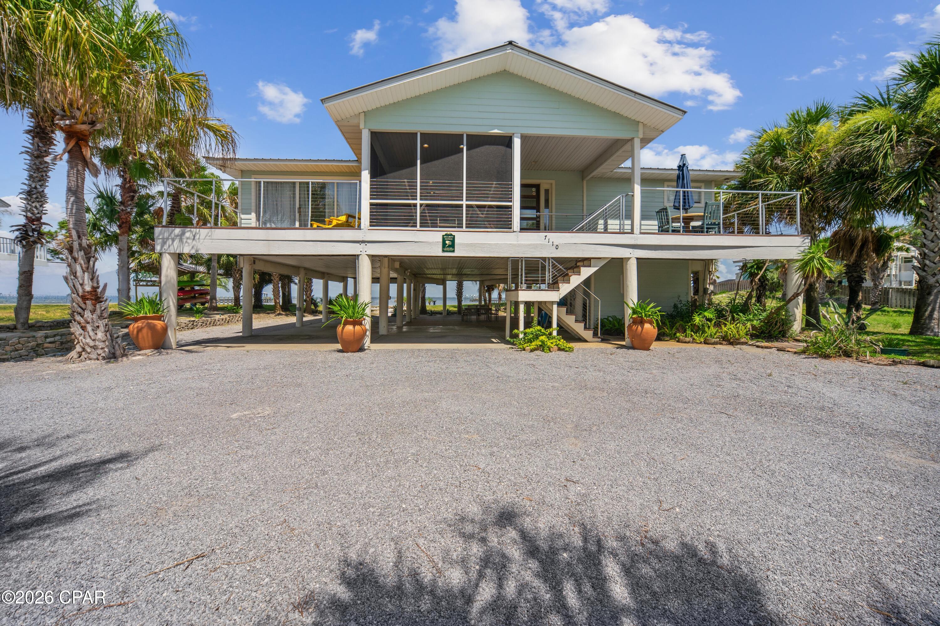 CURRENTLY UNDER CONTRACT, SELLER WILL CONSIDER BACKUP OFFERS. BAYFRONT SUNRISE RETREAT!! Experience the perfect blend of comfort, adventure & breathtaking natural beauty in this beautifully maintained 3-bedroom/2-bath bayfront home. Thoughtfully designed to embrace its spectacular waterfront setting, a dramatic wall of windows showcases panoramic views of St. Joseph Bay, where abundant marine life, coastal wildlife & unforgettable sunrises create a stunning backdrop for everyday living. Inside, the bright & inviting interior is designed to maximize the incredible views while offering comfortable spaces for gathering with family & friends. Whether enjoying a quiet morning coffee overlooking the water or unwinding after a day of coastal adventures, every room reflects the relaxed charm of bayfront living. Step outside & down to the waters edge to enjoy boating, paddleboarding, windsurfing, fishing, crabbing, snorkeling & endless days exploring the pristine waters of the bay. As the day winds down, gather around the fire pit to roast hot dogs & s'mores while taking in spectacular Gulf sunsets. Perfectly positioned between the bay & beach, this exceptional location offers one of the shortest walks to the Gulf, allowing you to enjoy the best of both worlds. Outdoor enthusiasts will appreciate the paved walking & biking path that spans the length of Cape San Blas, providing endless opportunities to explore the area's natural beauty. Nearby Salinas Park offers pickleball courts, horseback riding on the beach, kayak launches & bay access, while St. Joseph Peninsula State Park features scenic hiking trails, world-class birdwatching, exceptional fishing & unspoiled coastal landscapes. Whether you're searching for a primary residence, vacation getaway or investment opportunity, this remarkable bayfront retreat delivers the ultimate coastal lifestyle. Call for your private tour & LIVE THE BEACH LIFE!