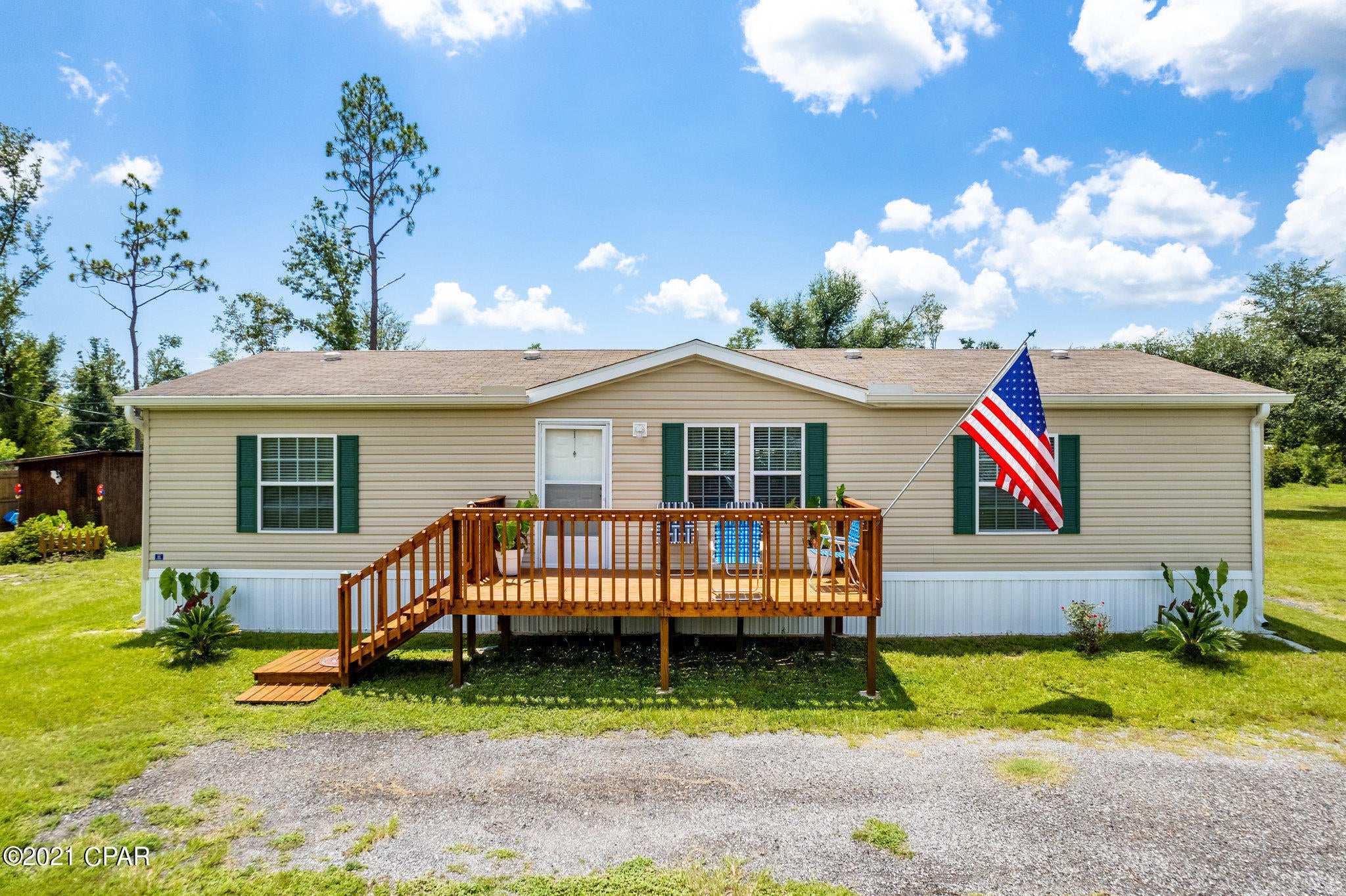 CURRENTLY UNDER CONTRACT, SELLER ACCEPTING BACKUP OFFERS!  Quiet country living yet close to town, this turn key property is located on a beautiful two acre corner lot.  The furniture conveys so this home would be perfect for a first time home buyer.  The kitchen boasts ample cabinets and a bar for extra seating.  Enjoy the fresh air on your screened in back porch, or relax on the porch swing outside. Plenty of room for extra parking, RV storage, boat, etc.  There is a fire hydrant located about 80 ft from home.  This home is beautiful and is move in ready!  Measurements to be verified by buyer if deemed important.