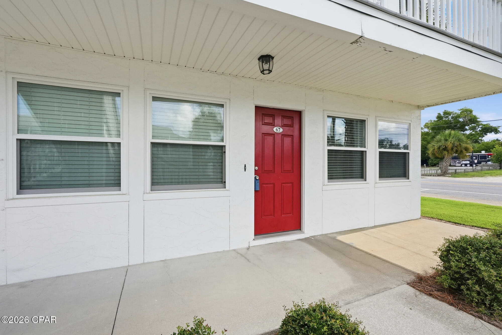 'CURRENTLY UNDER CONTRACT, SELLER WILL CONSIDER BACKUP OFFERS'  If you are looking to live in the heart of Historic St Andrews- then this is the place for you!  Saint Andrews Harbor Condominiums #67 is the perfect location to own your private residence or long term investment property, as it is centrally situated near all that downtown St. Andrews has to offer.  Located just steps from St. Andrews Bay, from restaurants, the boat dock, and not far from the marina this property offers all of the conveniences one needs for dining, entertainment, water sports, and just peaceful enjoyment.  Unit #67 is a 2 bedroom, 1 bath end unit condo that is located downstairs so steps will not be an issue.  With new marble tile flooring installed in 2025 in the bedrooms this update makes the unit look glamourous.  New modern ceiling fans installed in 2025. A new roof was installed on the building in 2019, new windows and doors thereafter, the air conditioner in the unit is a 2019, and the water heater was installed in 2018. The complex offers a community pool, a clubhouse, BBQ grills, and the HOA includes water, cable, sewer and garbage.  This quaint smaller complex makes for a relaxing, easy maintenance, quieter existence PLUS it offers all the benefits of just a short walk to all the 'beachy' type atmospheric establishments for the entertainment one seeks to have fun in the sun, to enjoy local seafood, or just to sit back and listen to some local entertainment  at one of the very popular local businesses.  Everything one needs for the Florida living lifestyle.  Come check out Saint Andrews Harbor #67, take a stroll to the water, enjoy a nice meal, and you will fall in love!  Watch the video in the photos section!