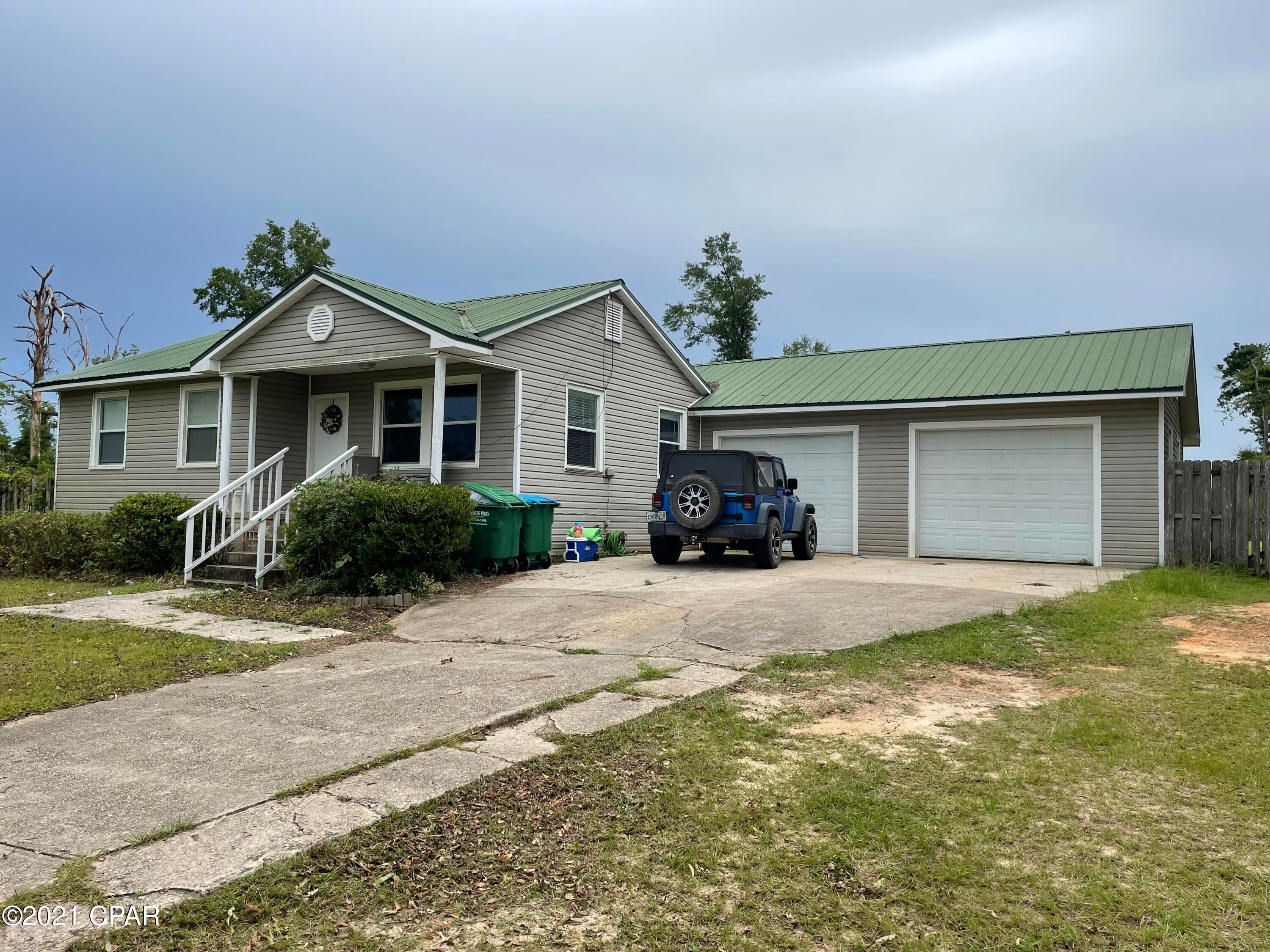 Sitting on 1.83 acres, in town, is this updated 2BR/2B home. laminate flooring, double pane windows, Central H/C replaced in 2017, newer stainless steel appliances, 2 car garage and lots of space!! Could be a good rental property with additional space to add more homes or duplexes. Zone to accommodate.