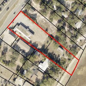 Beautiful Bay front lot with a commercial free standing building. This would be a wonderful site to build homes
or town homes. Beautiful waterfront  lot and over 1 acre. Building has been taken down to the studs. Heavy traffic count. Business or homes this will be a money maker for someone. Included is information for a 26 unit 
Home development which would be a money maker being so close to Tyndall Air Force Base. See Photo's for idea of what a developer could do here and make money!