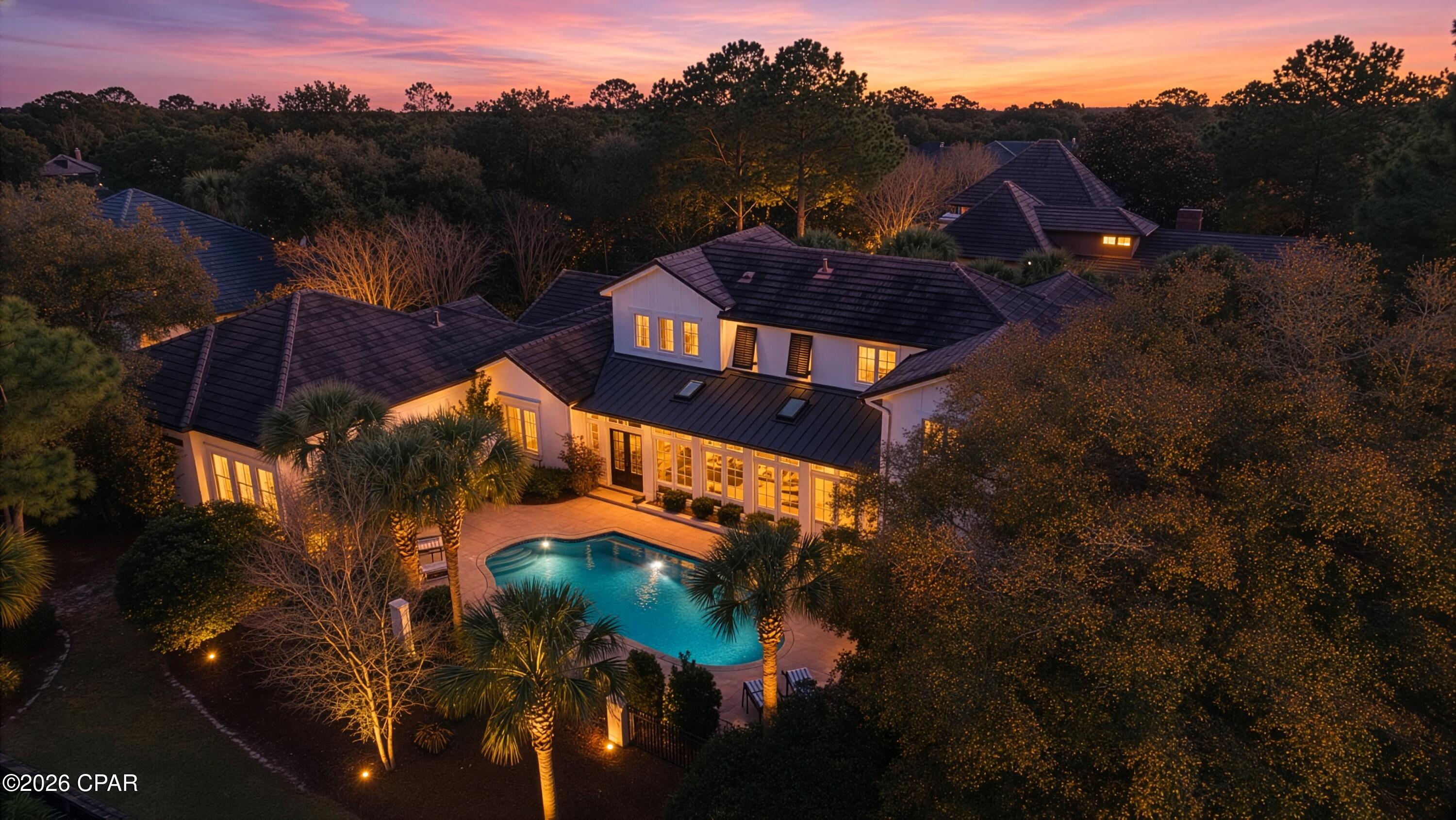 Privacy and Luxury is what 1533 Island Green Ln has to offer. This exquisite home in the gated Island Green neighborhood in the Sandestin Community showcases the perfect blend of spaciousness and comfort. This expansive 6,870 sq ft home has five spacious bedrooms and four and a half elegantly appointed bathrooms, this corner lot in Island Green offers ample space for your lifestyle needs.

Step inside to a grand foyer that leads to a stunning living area, adorned with chandeliers and bathed in natural light from the bay and floor-to-ceiling windows. The hardwood and carpet floors add warmth and sophistication throughout the home. The gourmet kitchen is a chef's dream, featuring an island kitchen with granite countertops, a breakfast bar, and top-of-the-line appliances including a stove, refrigerator, and dishwasher. Retreat to the main floor primary suite, complete with a walk-in closet and a luxurious marble bathroom featuring separate vanities, two walk in showers, a double sink, and a bidet.

Outdoors enjoy the private pool and expansive outdoor space. Sit on the water and watch the world renowned golf course of Burnt Pine come alive, or hop on over and play for yourself. Additional features include a golf cart garageThis fully furnished home is a rare gem, offering a lifestyle of elegance and convenience. Don't miss the opportunity to make this exceptional property your new home! Call today!