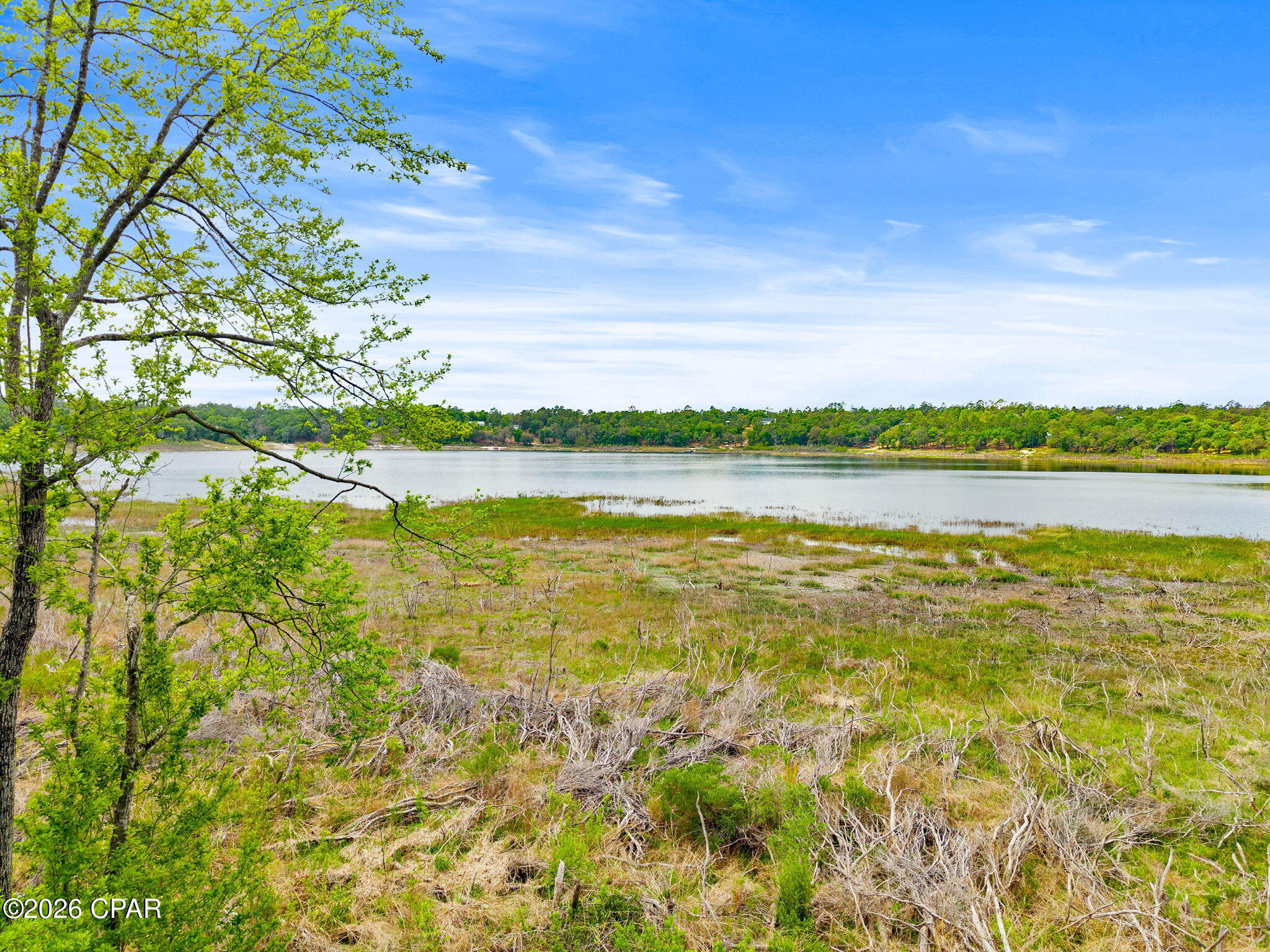 Discover the perfect blend of privacy and waterfront living with this beautiful 1.12-acre lot nestled in the gated Leisure Lakes community. This wooded, flat parcel offers an ideal setting to build your dream home, with plenty of space while still maintaining a natural, peaceful backdrop.
A rare and valuable feature, this property includes a natural spring on the lot, adding to its uniqueness and long-term appeal. Enjoy direct access to a spring-fed lake, perfect for fishing, kayaking, paddleboarding, swimming, and soaking in the serene surroundings.
Leisure Lakes offers a variety of amenities designed for both relaxation and recreation, including a community pool, pickleball and basketball courts, concrete boat launch, pavilion, picnic areas, and playground. The community also features a manned gate on weekdays, providing an added layer of security and peace of mind.
Nature lovers will appreciate the abundant wildlife, with frequent sightings of deer, birds, and turkeys throughout the neighborhood.
With low HOA fees of just $250/year, this property offers an exceptional opportunity to own a slice of waterfront paradise while enjoying community conveniences.
Whether you're looking to build now or invest for the future, this lot checks all the boxes. Call today to schedule your private tour.