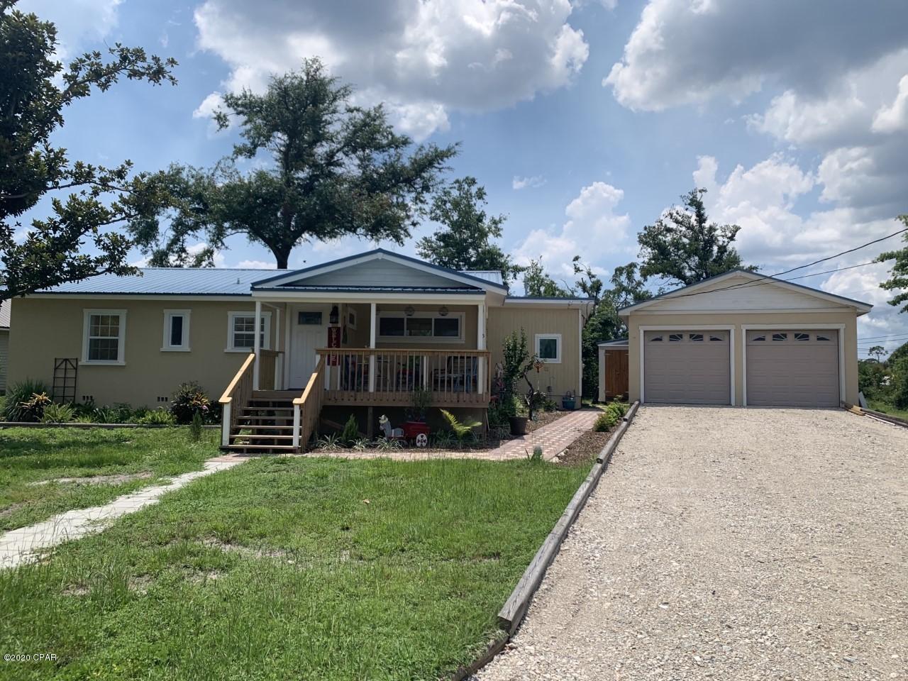 This updated Florida cottage features 2 bedroom and 2 full baths, vaulted ceiling in the kitchen with sky light, great Florida room, detached 2 car garage, covered rear patio and fantastic large front covered patio.