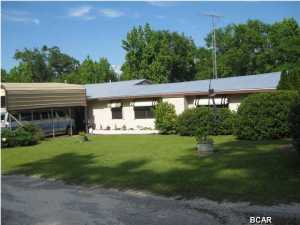 Here is your opportunity to own this 3 bedroom 2 bath house located on the historic DEAD lakes. This house is located approximately 5 miles north of the Wewahitchka just off of Hwy 71 directly on the dead lakes. This property is complete with covered boat storage and outbuildings with a covered carport. The bathrooms have handicap railing for the shower and the commode. This house was recently updated with a new roof and a septic tank and all new water lines through out the this home was recently updated with the S.h.i.p. program. The kitchen has nice appliances, dishwasher and microwave oven with a nice dining room. The yard is very nicely landscaped and is on a high bluff over looking the lake. The Dead Lakes are home to world class bass and bream fishing and is also the home of