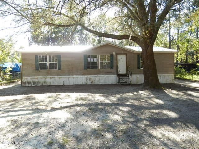 Doublewide on quarter acre lot offers a fully fenced yard w/lovely oak tree.  Light and bright interior includes a formal living room, super spacious kitchen w/dining area and prep/breakfast island, utility room, and 3 spacious bedrooms w/walk-in closets including a master suite w/full bathroom featuring dual sinks. Terrific area just NW of the downtown area super close to the Dead Lakes Recreation Area, 22, and 71!  This is a really lovely area that is very quiet.